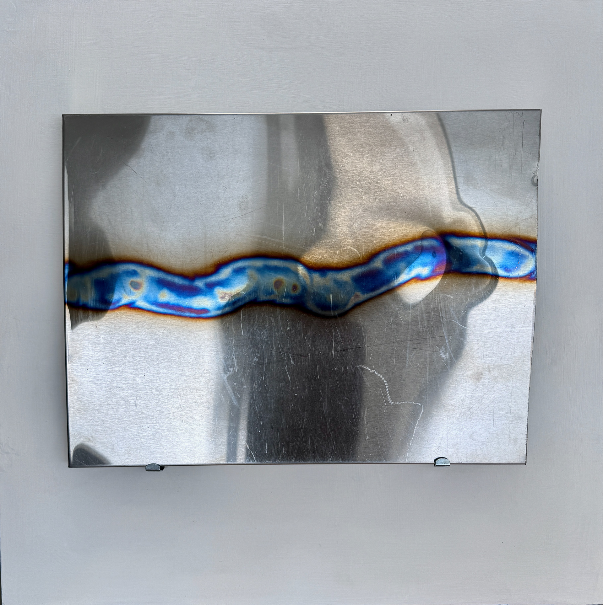 What Divides Us, Annealed SS, 24" x 18" on board