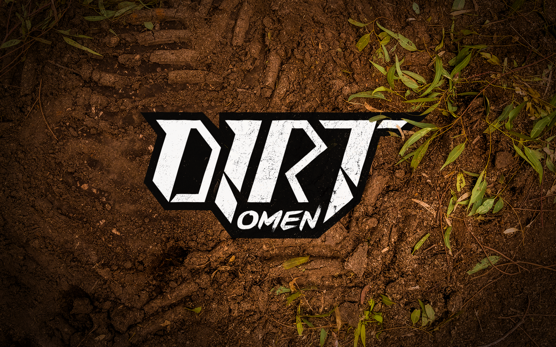Dirt Omen Logo placed on the dirt in the forrest