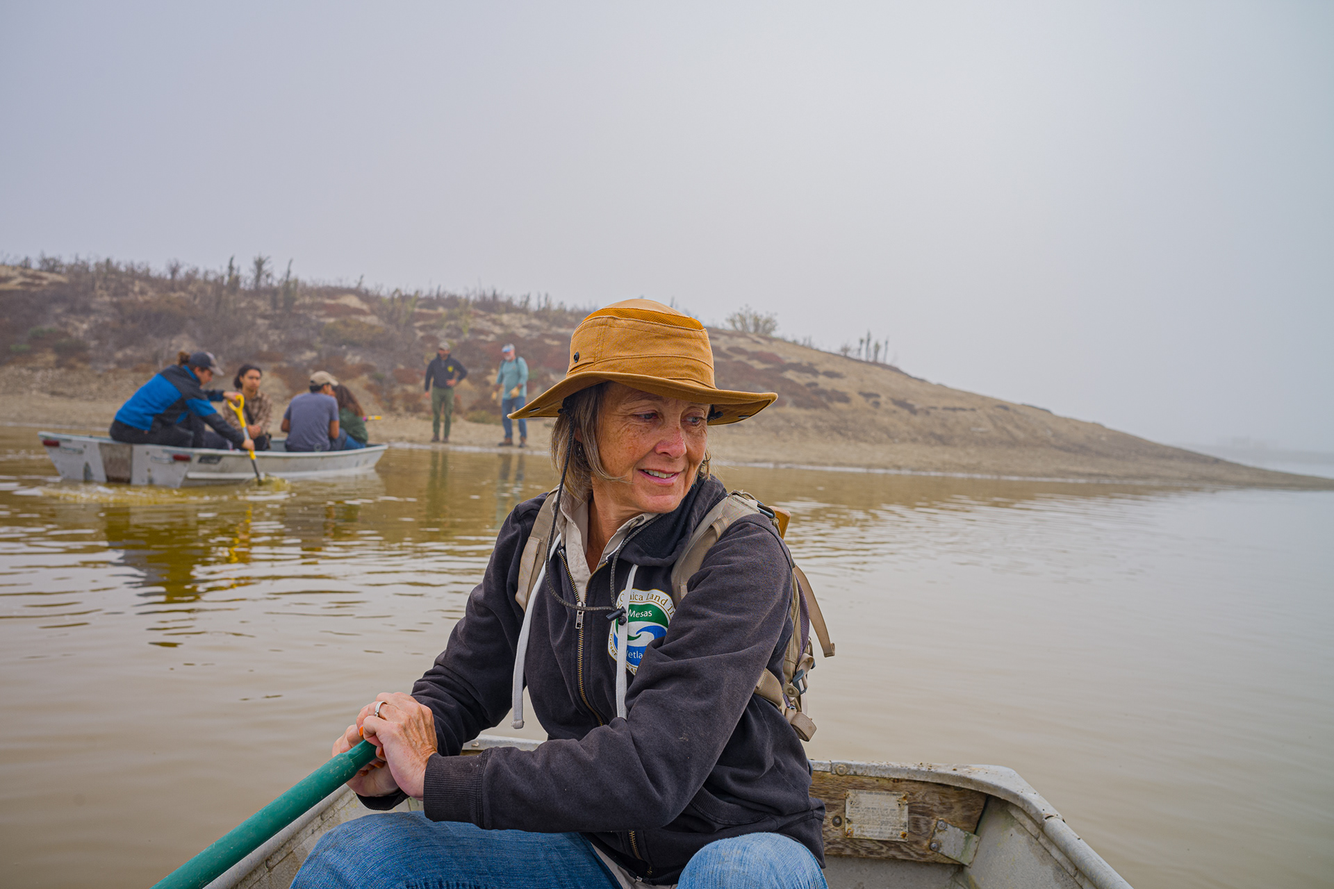  Bolsa Chica Land Trust Director of Restoration and Stewardship Beverley Hansen rows across towards the island with a couple of volunteers. To get to the island you need to cross by kayak.  Photo Credit: Justin Enriquez