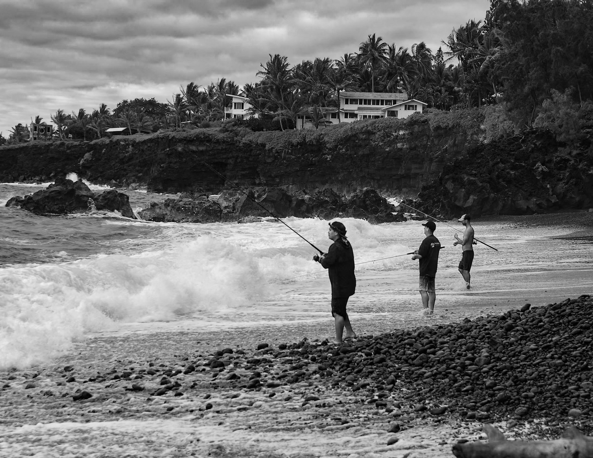 Fishermen at Kehena Black Sand Beach