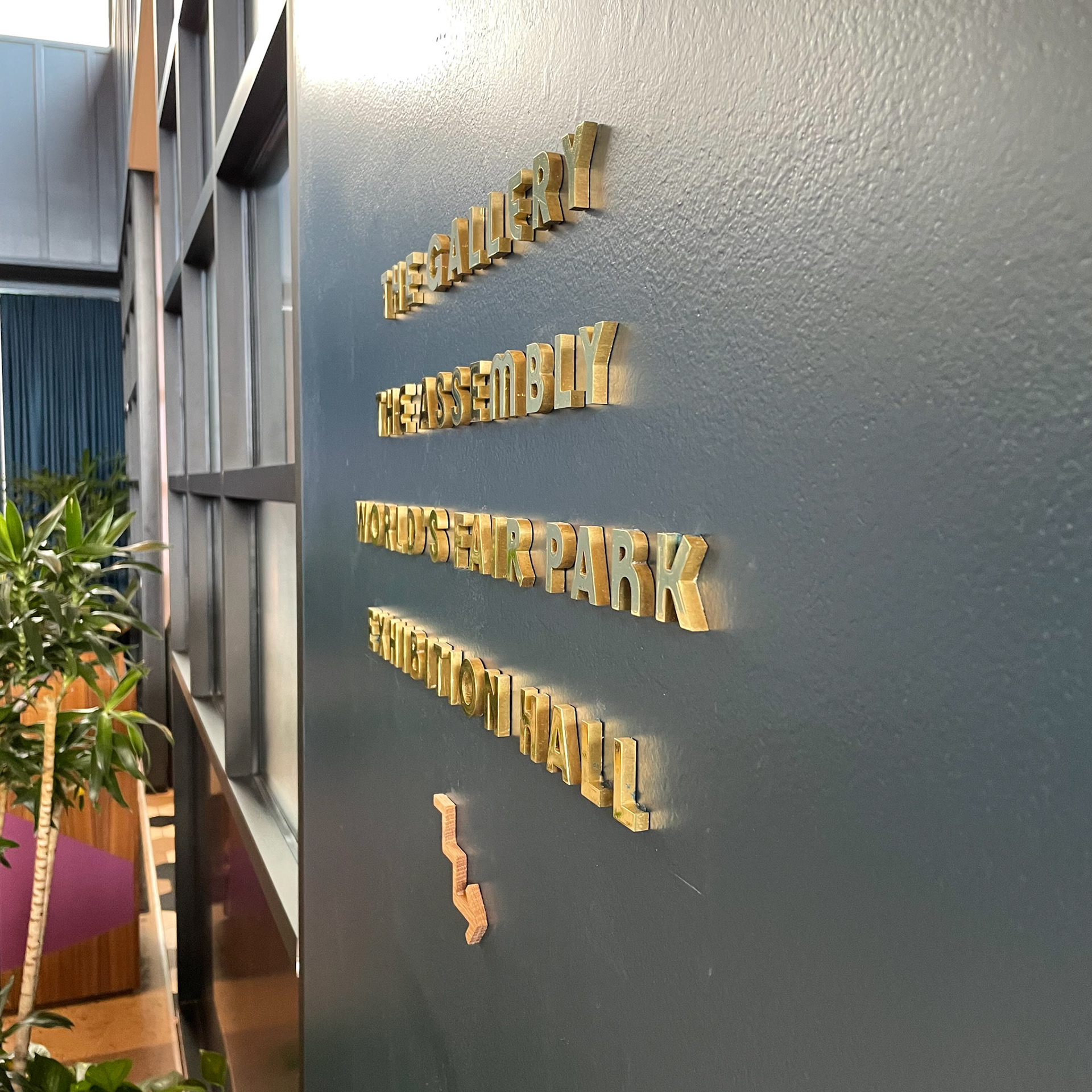 solid brass and white oak wayfinding
