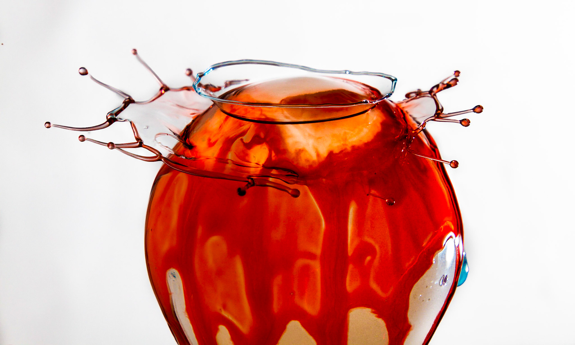 Red water drop on light