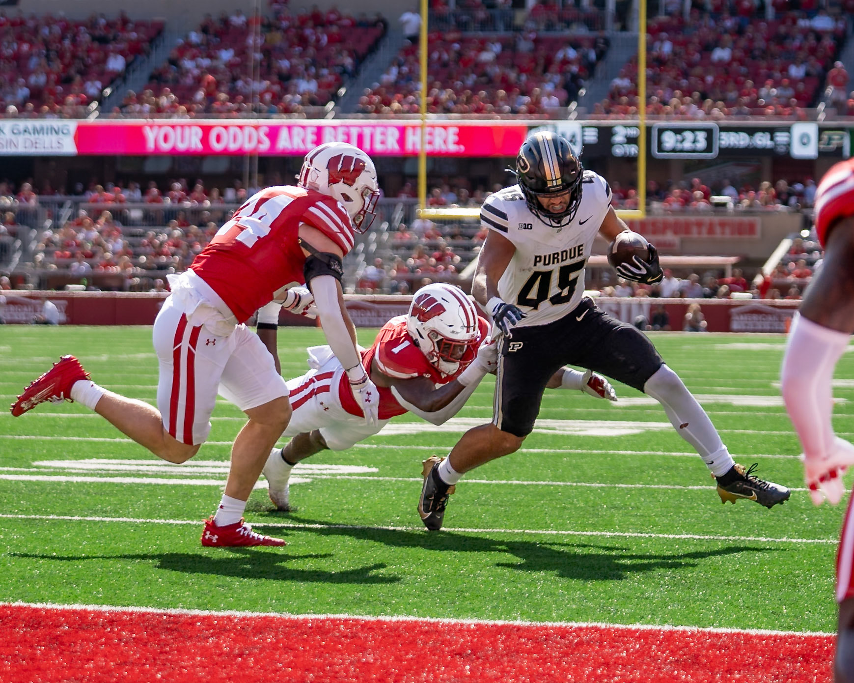 MADISON, WI - OCTOBER 5, 2024: Purdue University Junior Running Back Devin Mockobee (45) running near the gola line while being chased by University of Wisconsin Senior ILB Jake Chaney (1) and University of Wisconsin Senior S Hunter Wohler (24) during the Purdue University Boilermakers at University of Wisconsin Badger Football game at Camp Randall Stadium(Photo by Steve Bowen / NISports Report)