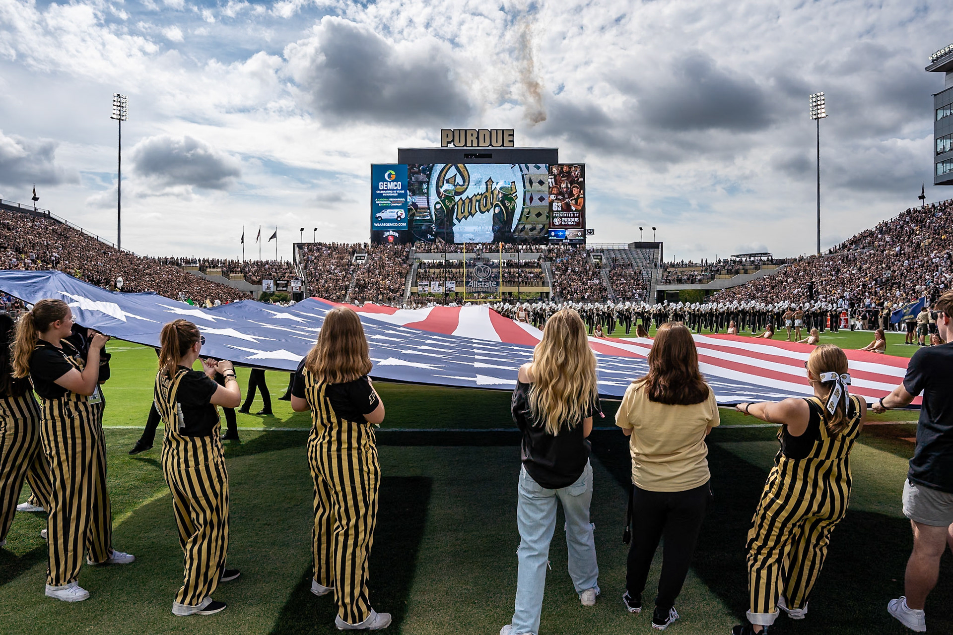 WEST LAFAYETTE, IN - AUGUST 30, 2024: Purdue students hold a lrge american flag while the National Anthem is played before the Purdue Boilermaker vs Indiana State Sycamores football game at Ross-Ade Stadium(Photo by Steve Bowen / Bowen Arrow Photography / Northern Indiana Sports Report)