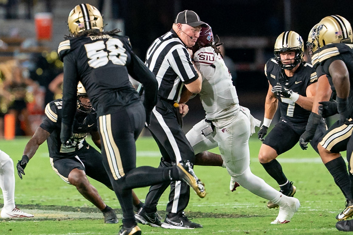 WEST LAFAYETTE, IN - SEPTEMBER 6, 2025: Southern Illinois University Sr. QB DJ Williams (1) runs into the umpire at Purdue Boilermaker Football vs Southern Illinois Saluki Football at Ross-Ade Stadium(Photo by Steve Bowen / Northern Indiana Sports Report)