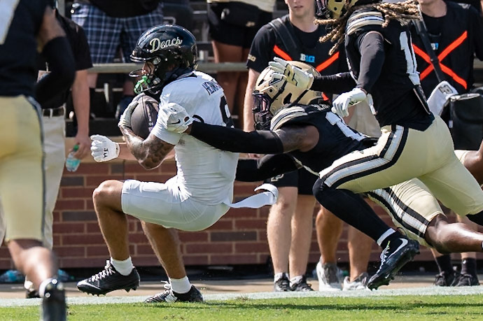WEST LAFAYETTE, IN - SEPTEMBER 12, 2026: Wake Forest University Wide Receiver Carlos Hernandez (8) barely gets the 15 yards needed for a first down while Purdue University Junior Defensive Back John Slaughter (13) tries to stop him during the Purdue Boilermakers football game vs the Wake Forest Demon Deacons at Ross-Ade Stadium(Photo by Steve Bowen / Northern Indiana Sports Report)