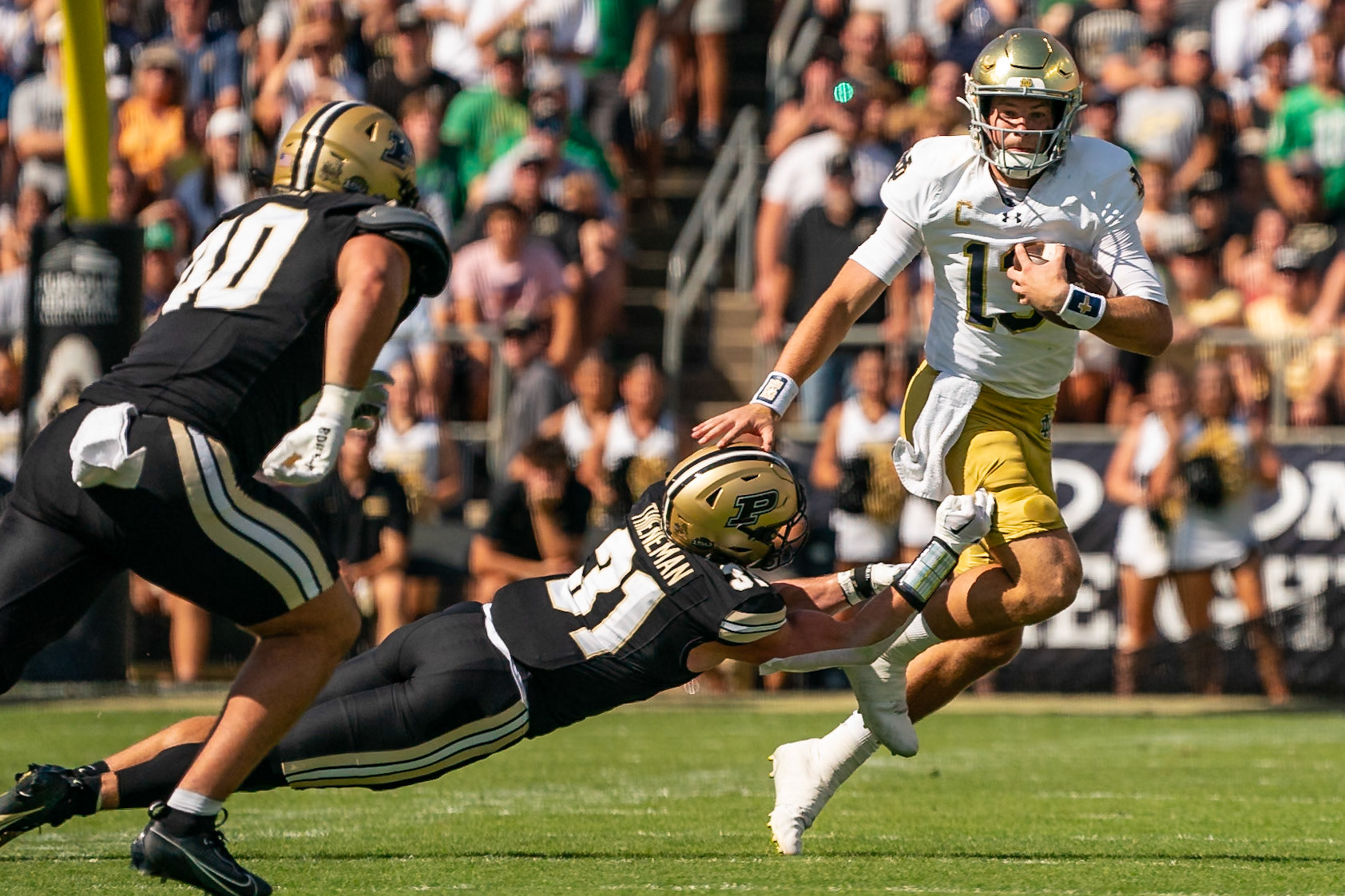 WEST LAFAYETTE, IN - SEPTEMBER 14, 2024: Notre Dame Senior QB Riley Leonard (13), Purdue So. Defensive Back Dillon Thieneman (31) during the Purdue University Boilermakers vs Notre Dame Fighting Irish Football game at Ross-Ade Stadium(Photo by Steve Bowen / Bowen Arrow Photography / Northern Indiana Sports Report)