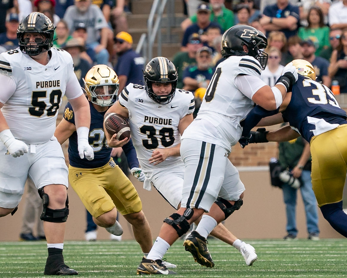 SOUTH BEND, IN - SEPTEMBER 20, 2025: Purdue University Senior Punter Jack McCallister (38) takes off for a first down on a fake punt during the Purdue Boilermakers at Notre Dame Fighting Irish Football at Notre Dame Stadium(Photo by Steve Bowen / Northern Indiana Sports Report)
