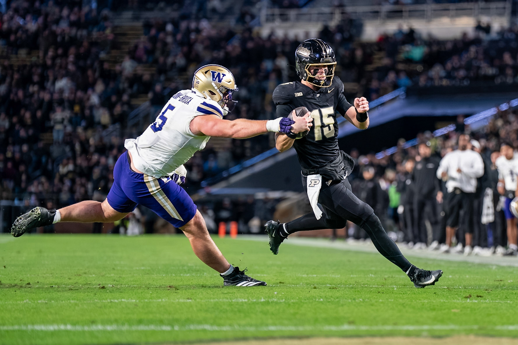 WEST LAFAYETTE, IN - OCTOBER 16, 2026: Purdue University Quarterback Ryan Browne (15), University of Washington DL Derek Colman-Brusa (5) during the Purdue Boilermakers vs Washington Huskies football game at Ross-Ade Stadium(Photo by Steve Bowen / Northern Indiana Sports Report)