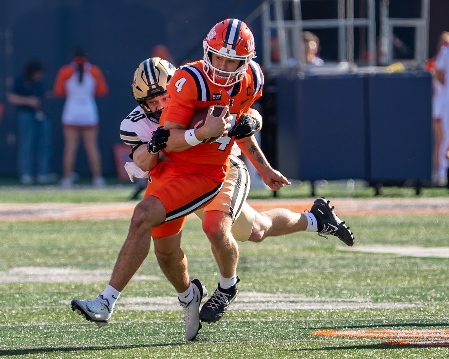 CHAMPAIGN, IL - OCTOBER 3, 2026: University of Illinois 5th Year QB Katin Houser (4), Purdue University Linebacker Winston Berglund (20) during the Purdue Boilermakers at Illinois Fighting Illini football game at Gies Memorial Stadium(Photo by Steve Bowen / Northern Indiana Sports Report)