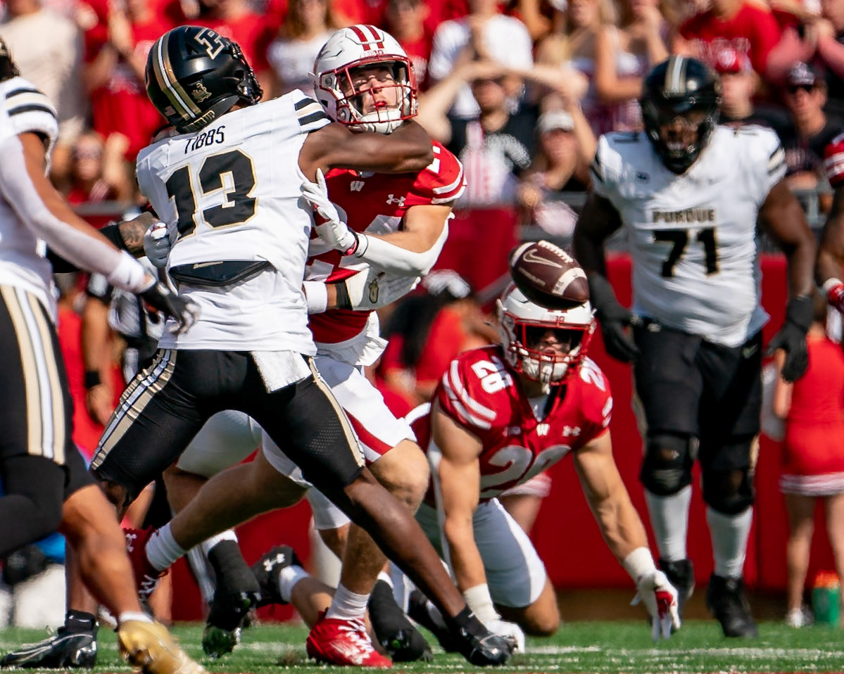 MADISON, WI - OCTOBER 5, 2024: Purdue University Sophomore Wide Receiver Jaron Tibbs (13) holding back University of Wisconsin Senior S Hunter Wohler (24) during the Purdue University Boilermakers at University of Wisconsin Badger Football game at Camp Randall Stadium(Photo by Steve Bowen / NISports Report)