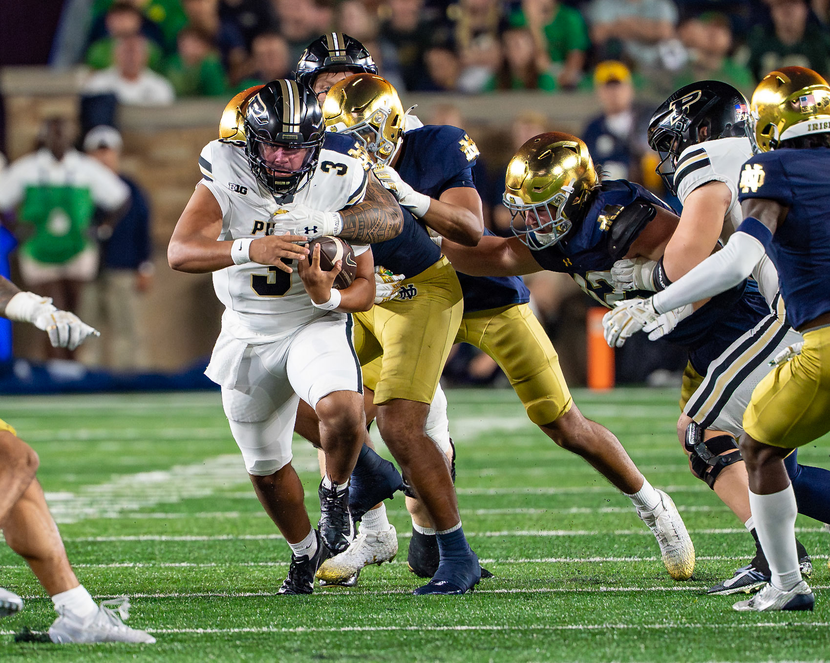 SOUTH BEND, IN - SEPTEMBER 20, 2025: Purdue University Sophomore Quaterback Malachi Singleton (3) itrying to avoid a sack during the Purdue Boilermakers at Notre Dame Fighting Irish Football at Notre Dame Stadium(Photo by Steve Bowen / Northern Indiana Sports Report)