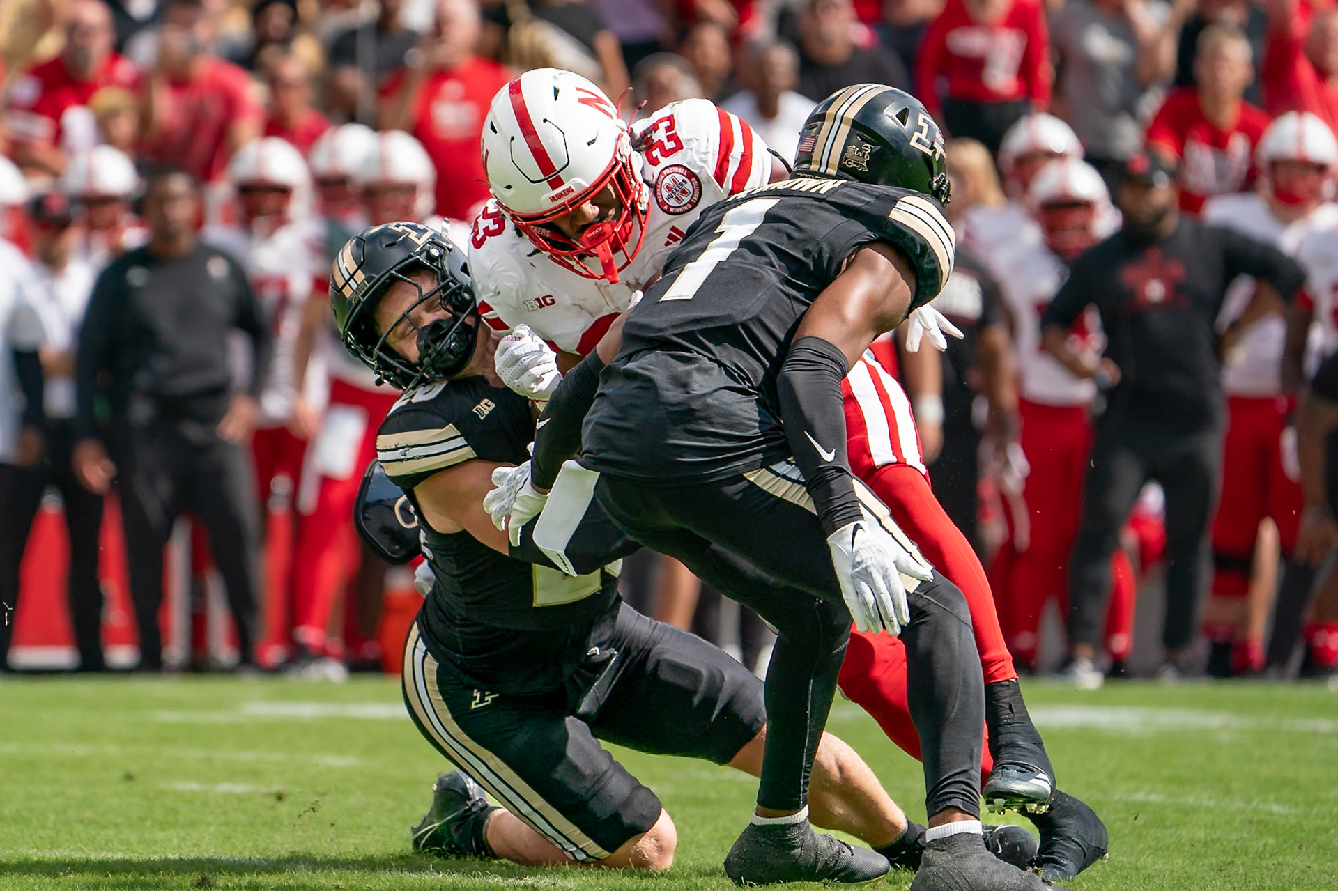 WEST LAFAYETTE, IN - SEPTEMBER 28, 2024: Nebraska University Sophomore Running Back Dante Dowdell (23), Purdue University Redshirt Freshman Linebacker Winston Berglund (20), Purdue University Senior Defensive Back Markevious Brown (1) during the Purdue University Boilermakers vs Nebraska University Cornhuskers Football game at Ross-Ade Stadium(Photo by Steve Bowen / Bowen Arrow Photography / Northern Indiana Sports Report)