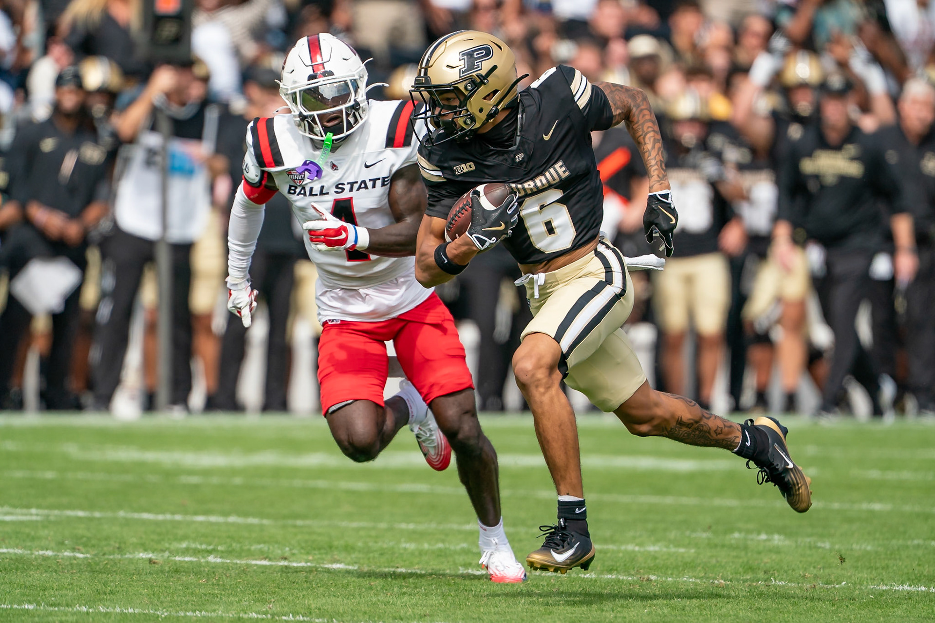 WEST LAFAYETTE, IN - AUGUST 30, 2025: Purdue University Sophomore Wide Receiver Arhmad Branch (6) running towards the end zone as Ball State University So. DB Eric McClain (4) gives chase at Purdue Boilermaker Football vs Ball State Football at Ross-Ade Stadium(Photo by Steve Bowen / Northern Indiana Sports Report)