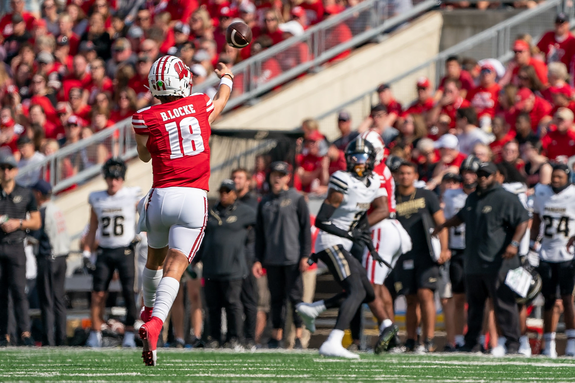MADISON, WI - OCTOBER 5, 2024: University of Wisconsin Redshirt Sophomore QB Braedyn Locke (18) throwiong a pass during the Purdue University Boilermakers at University of Wisconsin Badger Football game at Camp Randall Stadium(Photo by Steve Bowen / NISports Report)