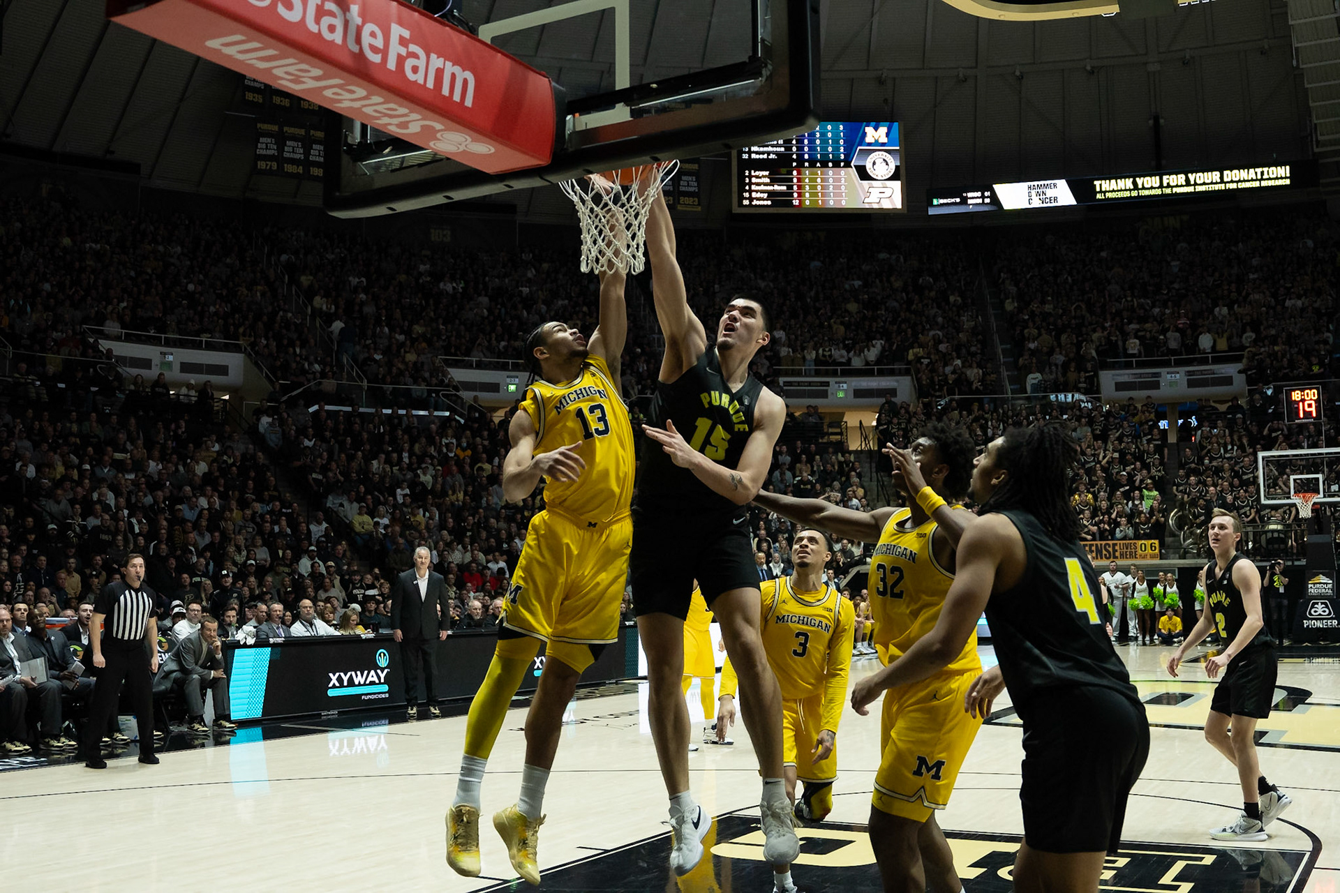 WEST LAFAYETTE, IN - JANUARY 23, 2024: Purdue Senior Center Zach Edey (15), Michigan Graduate Forward Olivier Nkamhoua (13) competing in Purdue versus Michigan Mens Basketball at Mackey Arena(Photo by Steve Bowen / Bowen Arrow Photography / Northern Indiana Sports Report)