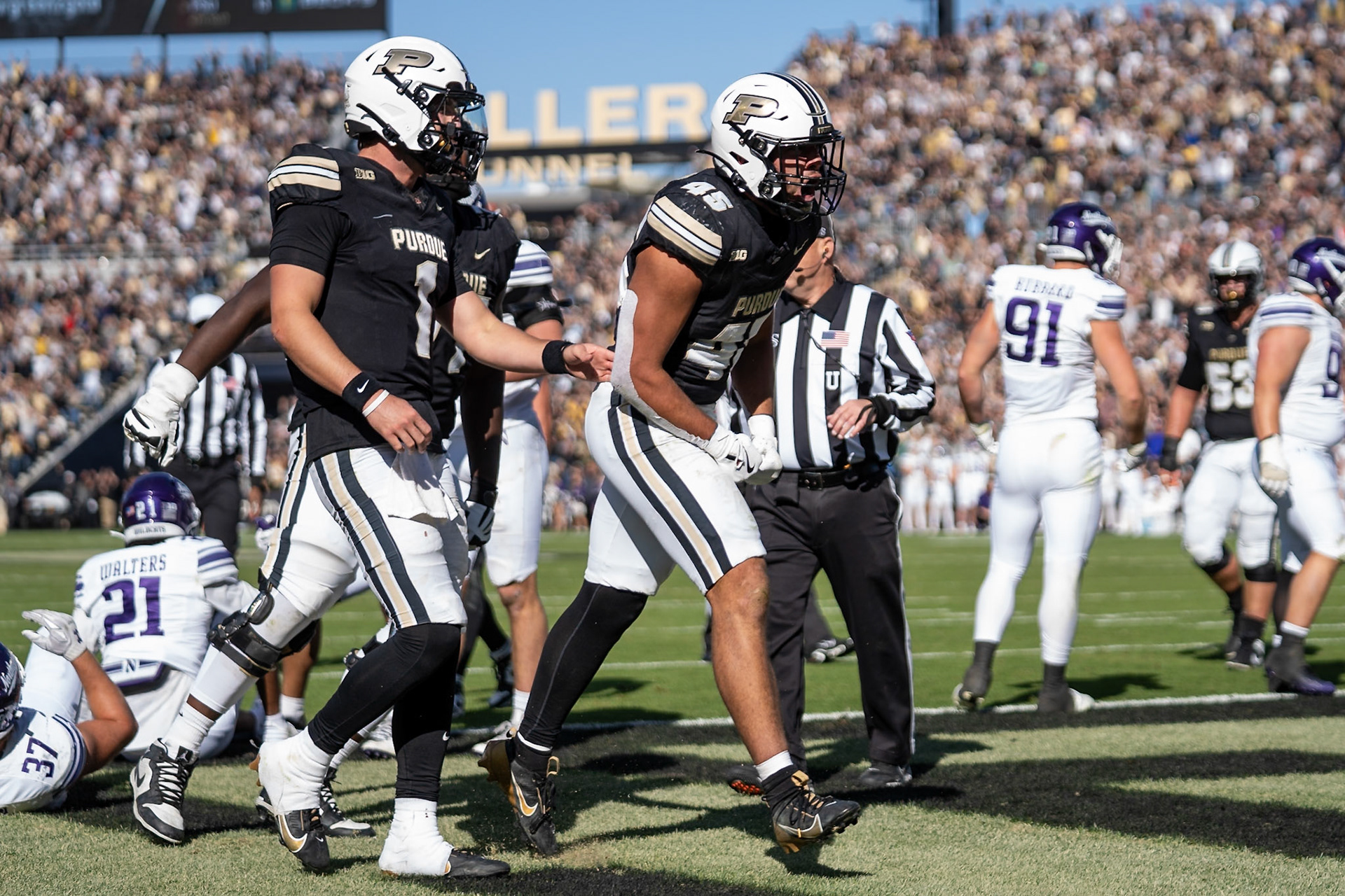WEST LAFAYETTE, IN - NOVEMBER 2, 2024: Purdue University Junior Running Back Devin Mockobee (45) celebrates with Purdue University Senior Quaterback Hudson Card (1) after scoring a touchdown during the Purdue University Boilermakers vs Northwestern University Wildcats Football game at Ross-Ade Stadium(Photo by Steve Bowen / Bowen Arrow Photography / Northern Indiana Sports Report)