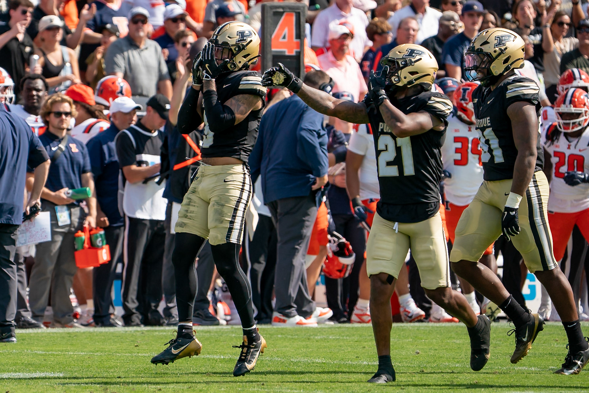 WEST LAFAYETTE, IN - OCTOBER 4, 2025: Purdue University Senior Defensive Back Myles Slusher (9), Purdue University Senior Defensive Back Tahj Ra-El (21) and Purdue University Senior Defensive Lineman CJ Nunnally IV (91) celebrate a big stop during the Purdue Boilermaker Football vs University of Illinois Fighting Illini at Ross-Ade Stadium(Photo by Steve Bowen / Northern Indiana Sports Report)