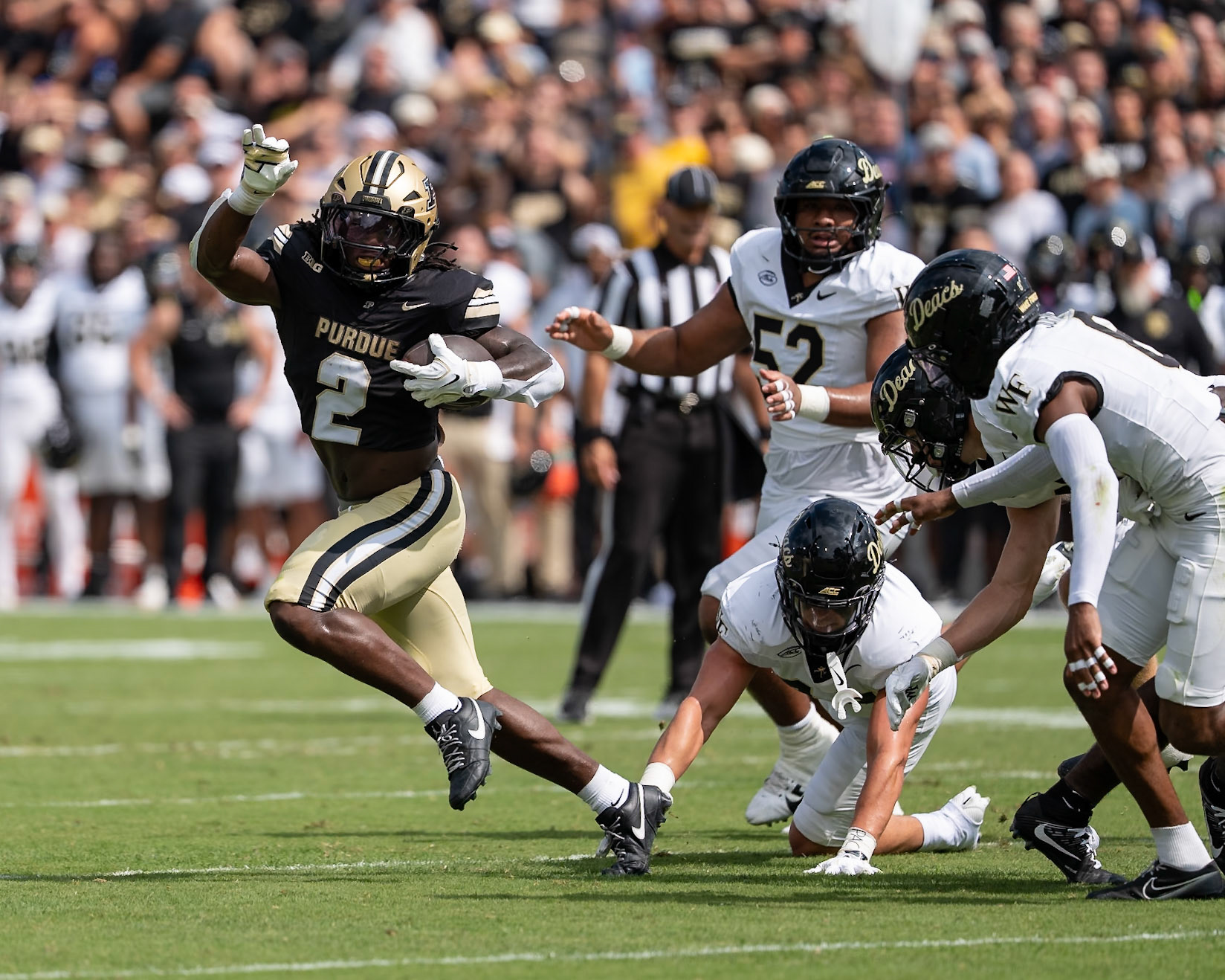 WEST LAFAYETTE, IN - SEPTEMBER 12, 2026: Purdue University Sophomore Running Back Fame Ijeboi (2) escapes the grasp of Wake Forest University Linebacker Frank Cusano (43) during the Purdue Boilermakers football game vs the Wake Forest Demon Deacons at Ross-Ade Stadium(Photo by Steve Bowen / Northern Indiana Sports Report)
