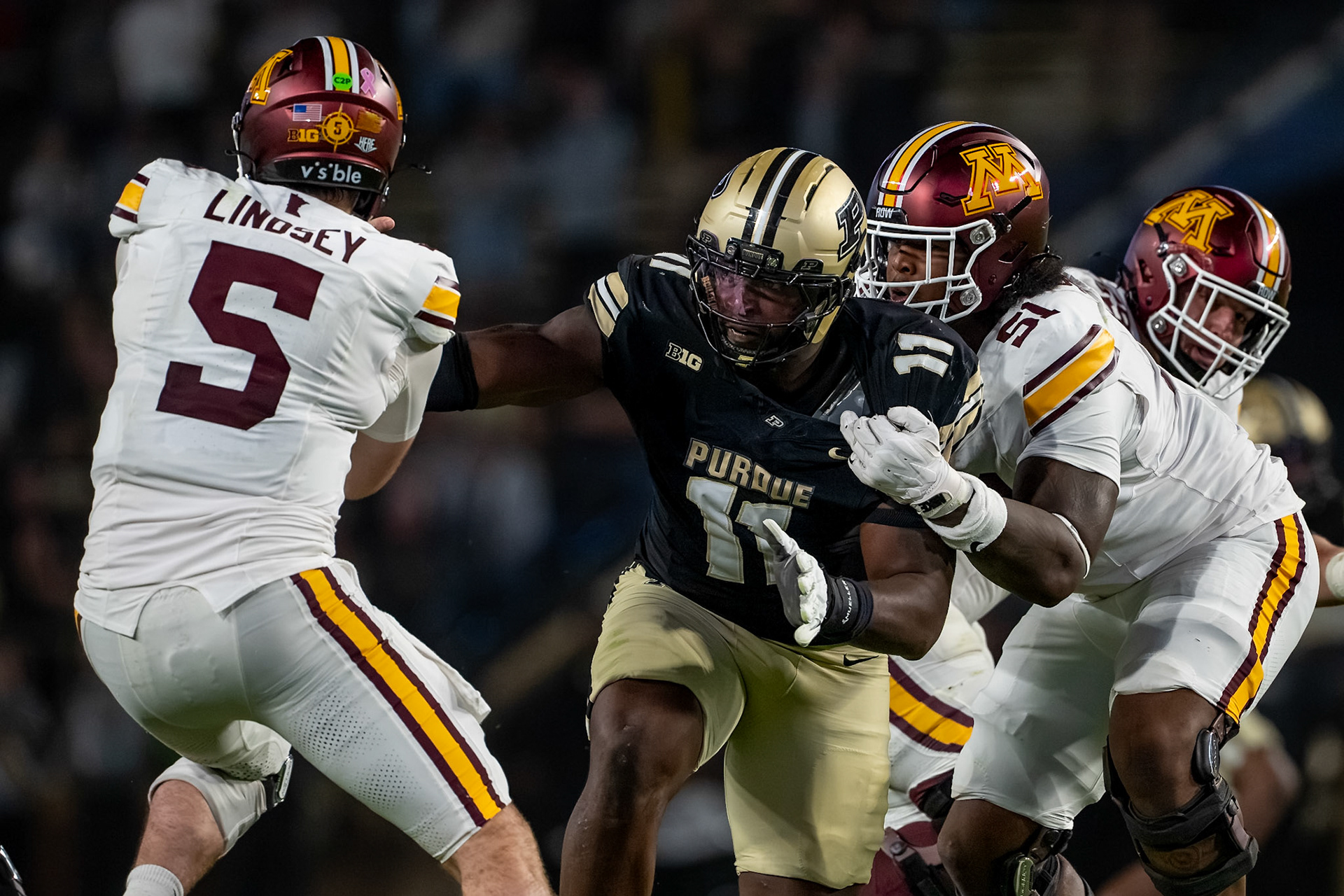 WEST LAFAYETTE, IN - OCTOBER 10, 2026: Purdue University Senior Defensive End Keyshawn Burgos (11), University of Minnesota Junior QB Drake Lindsey (5), University of Minnesota Sophomore OL Daniel Shipp (51) during the Purdue Boilermakers vs Minnesota Golden Gophers football game at Ross-Ade Stadium(Photo by Steve Bowen / Northern Indiana Sports Report)