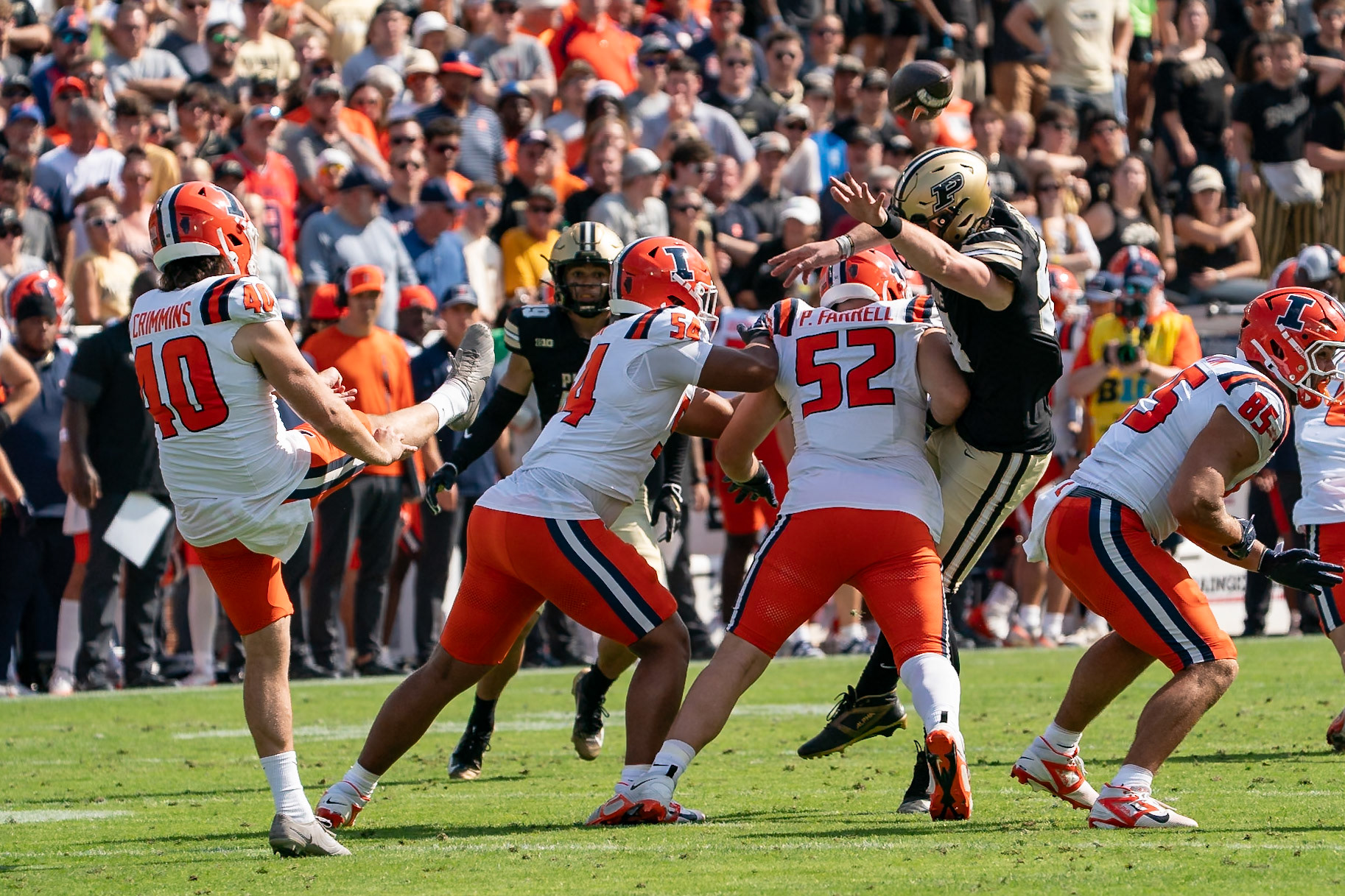 WEST LAFAYETTE, IN - OCTOBER 4, 2025: Purdue University Junior Offensive Lineman Hayden Timosciek (54) gets close to blocking the punt by University of Illinois’ Senior P Keelan Crimmins (40) but gets stopped by University of Illinois Sophomore DL Pat Farrell (52) and University of Illinois Redshirt Freshman DL Demetrius John (54) in Purdue Boilermaker Football vs University of Illinois Fighting Illini at Ross-Ade Stadium(Photo by Steve Bowen / Northern Indiana Sports Report)