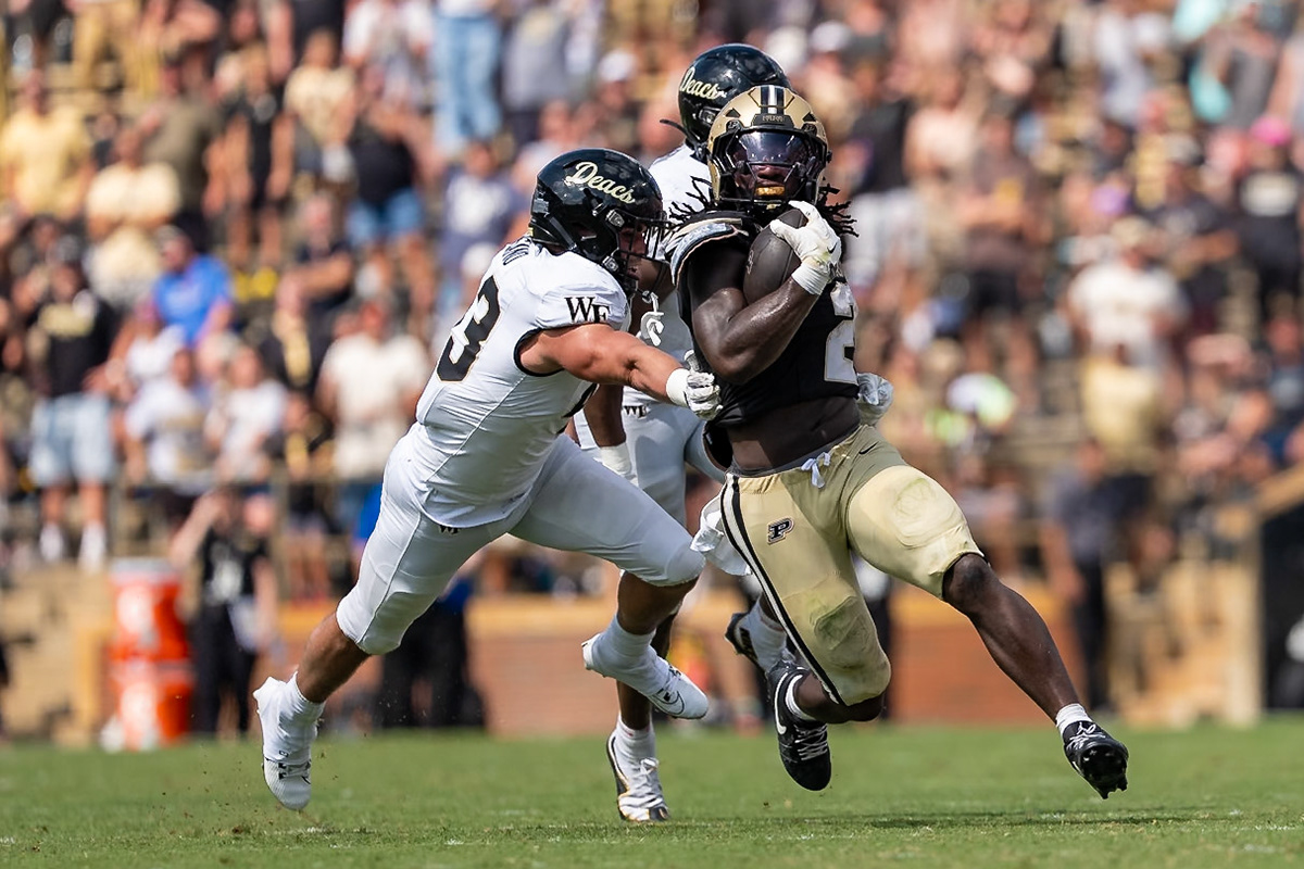 WEST LAFAYETTE, IN - SEPTEMBER 12, 2026: Purdue University Sophomore Running Back Fame Ijeboi (2) races past the outstreched arms of Wake Forest University Linebacker Frank Cusano (43) during the Purdue Boilermakers football game vs the Wake Forest Demon Deacons at Ross-Ade Stadium(Photo by Steve Bowen / Northern Indiana Sports Report)