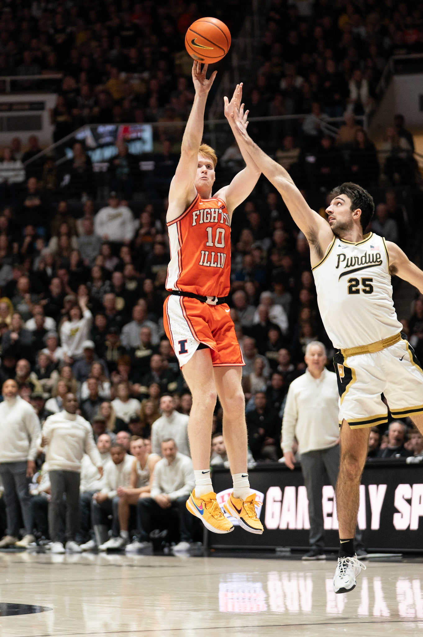 WEST LAFAYETTE, IN - JANUARY 5, 2024: Illinois Junior Guard/Forward Luke Goode (10) shoots a three while Purdue Senior Guard Ethan Morton (25) goes for the block in Purdue Boilermaker's Basketball vs the Illinois Fighting Illini at Mackey Arena(Photo by Steve Bowen / Bowen Arrow Photography / Northern Indiana Sports Report)