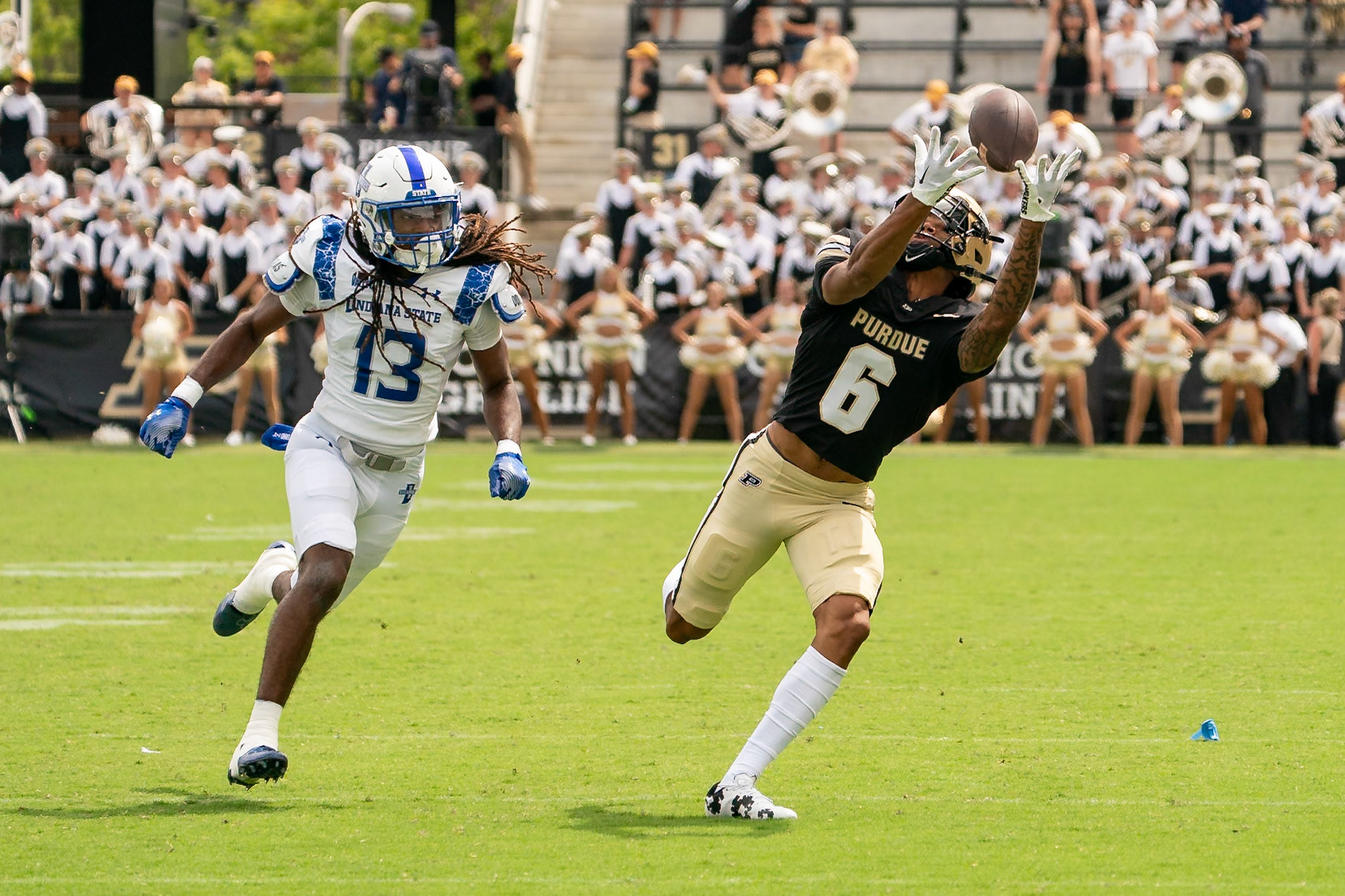 WEST LAFAYETTE, IN - AUGUST 31, 2024: Purdue R-Fr. WR Arhmad Branch (6) reaches out for a catch while being chased by Indiana State's Jr. DB Keenan Hicks (13) in the Purdue Boilermaker vs Indiana State Sycamores football fame at Ross-Ade Stadium(Photo by Steve Bowen / Bowen Arrow Photography / Northern Indiana Sports Report)