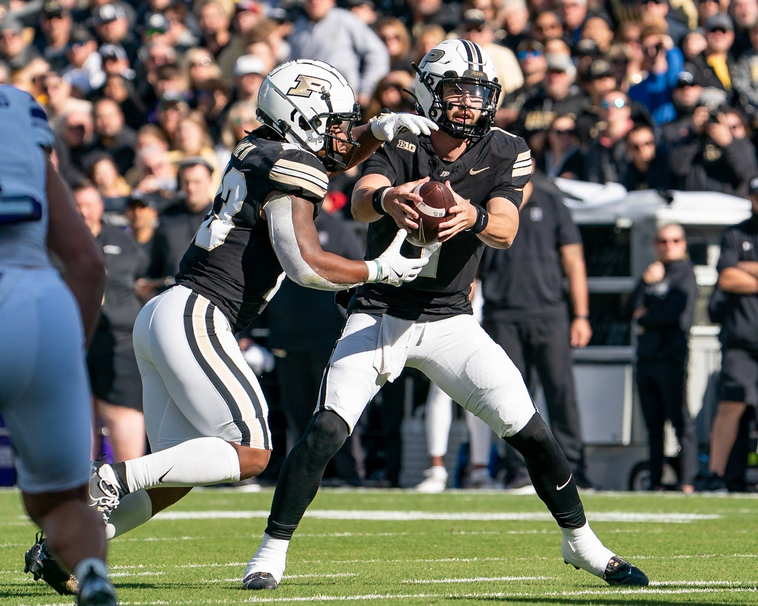 WEST LAFAYETTE, IN - NOVEMBER 2, 2024: Purdue University Senior Quaterback Hudson Card (1) handing off to Purdue University Senior Running Back Reggie Love III (23) during the Purdue University Boilermakers vs Northwestern University Wildcats Football game at Ross-Ade Stadium(Photo by Steve Bowen / Bowen Arrow Photography / Northern Indiana Sports Report)