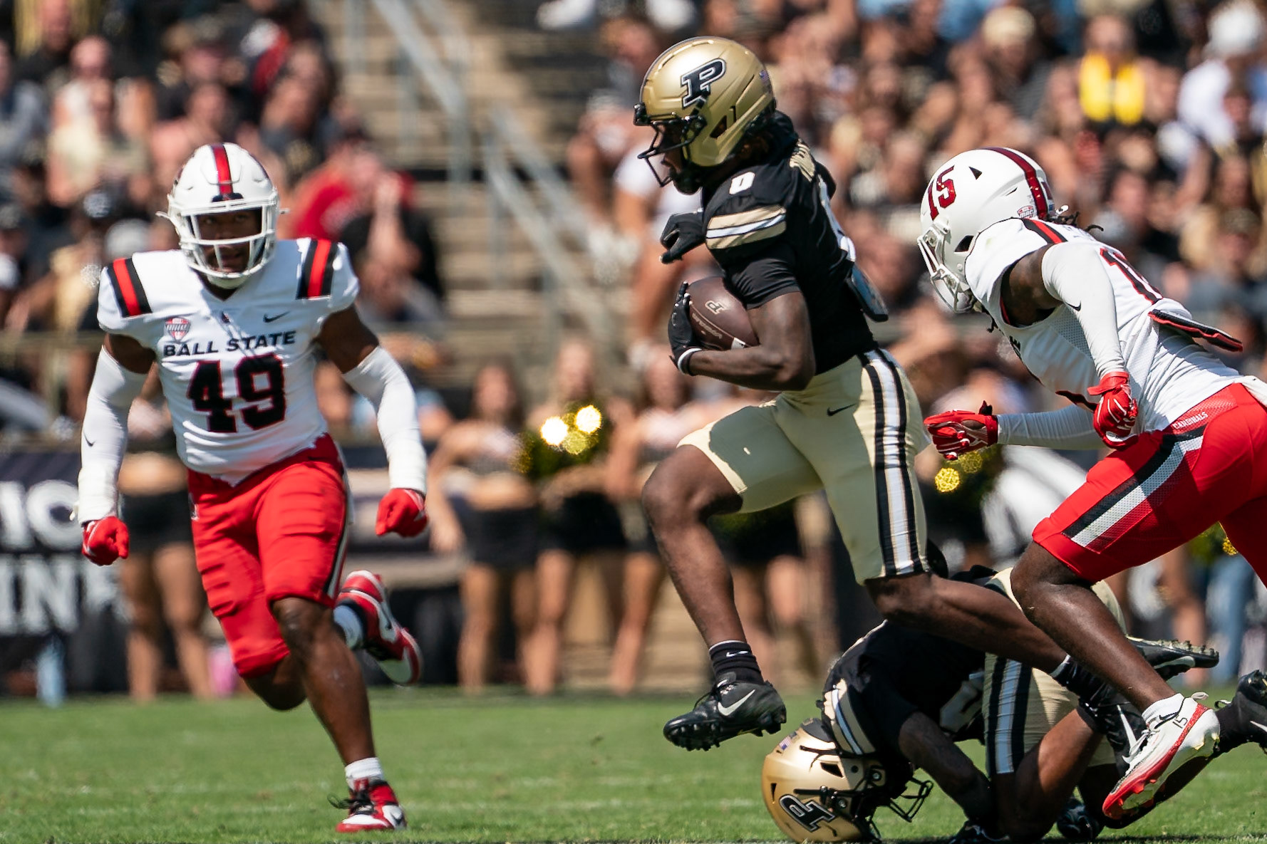 WEST LAFAYETTE, IN - AUGUST 30, 2025: Purdue University Sophomore Wide Receiver Nitro Tuggle (0) weraves through traffic as Ball State University R-So. DB Derek "DJ" Fields (15) gives chase at Purdue Boilermaker Football vs Ball State Football at Ross-Ade Stadium(Photo by Steve Bowen / Northern Indiana Sports Report)