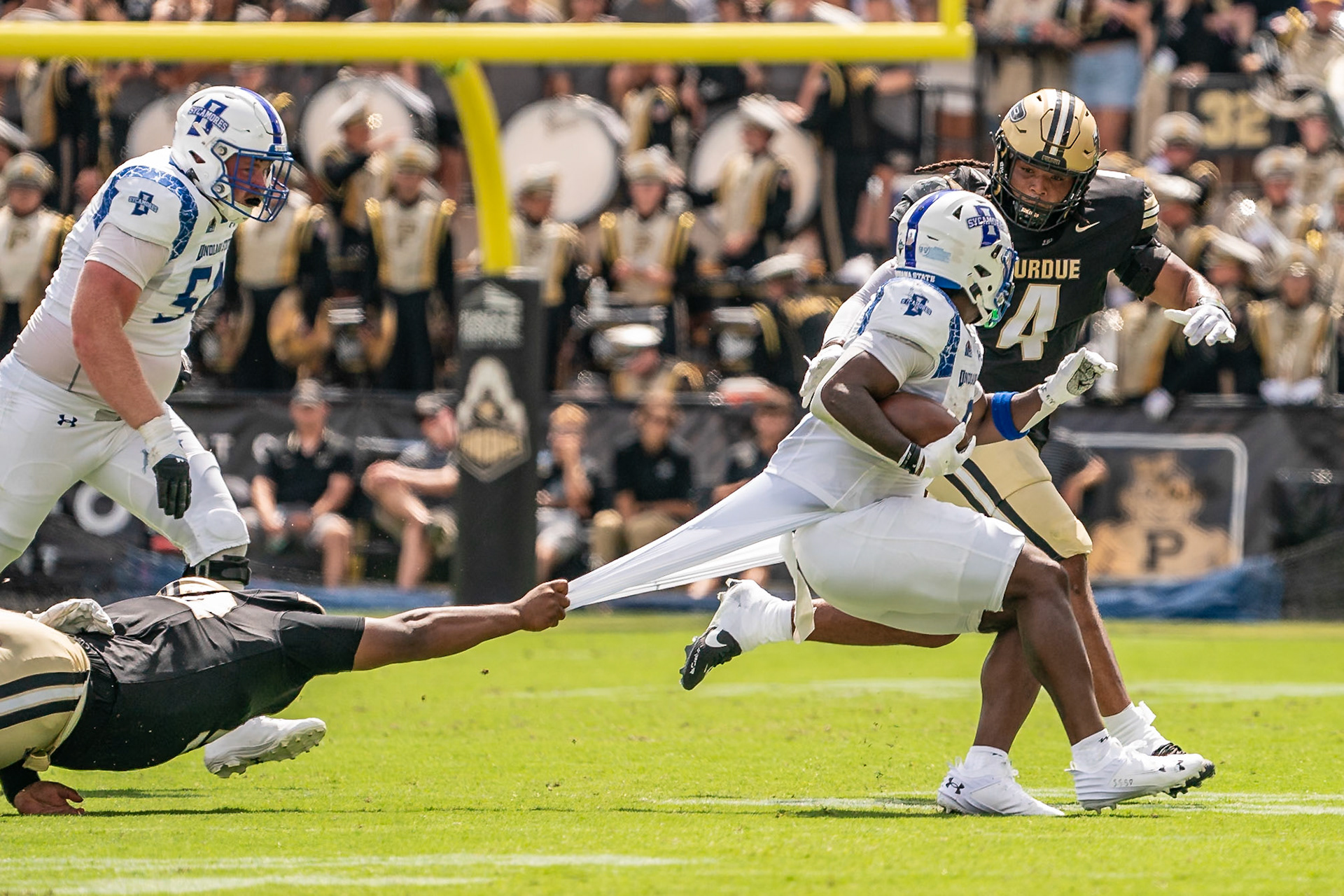 WEST LAFAYETTE, IN - AUGUST 31, 2024: Purdue Jr. DL Mo Omonode (92) holds on to Indiana State Sr. RB Shen Butler-Lawson (9) in an effort to tackle him at the Purdue vs Indiana State Sycamores football game at Ross-Ade Stadium(Photo by Steve Bowen / Bowen Arrow Photography / Northern Indiana Sports Report)