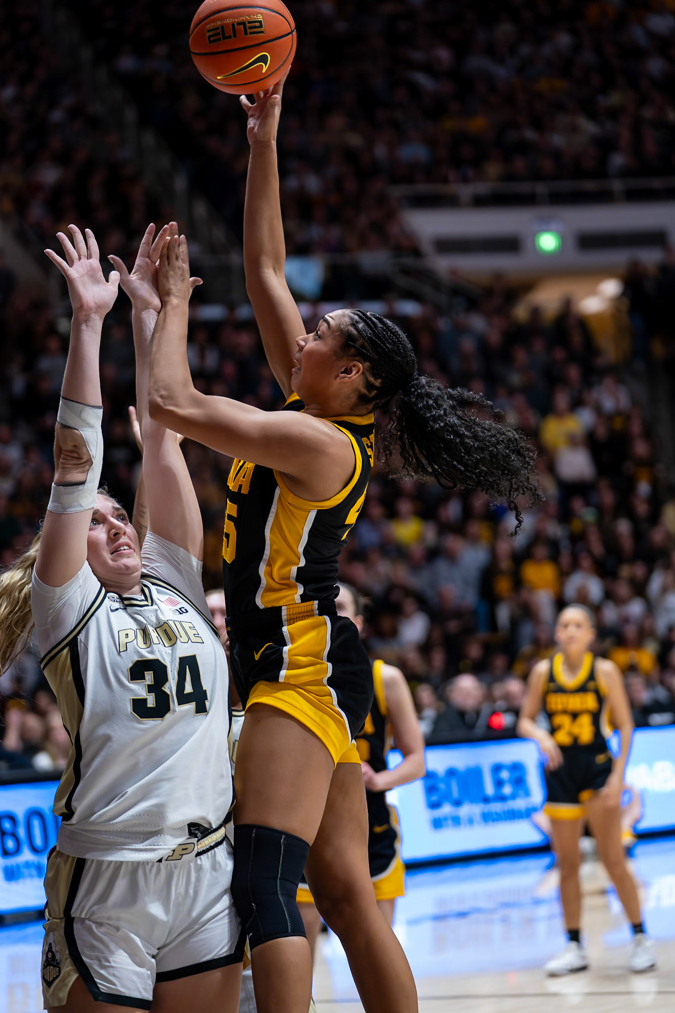 WEST LAFAYETTE, IN - JANUARY 10, 2024: Purdue 6th Year Forward Caitlyn Harper (34), Iowa Forward Sophomore Hannah Stuelke (45) competing in Purdue Boilermaker Women's Basketball vs the Iowa Hawkeyes at Mackey Arena(Photo by Steve Bowen / Bowen Arrow Photography / Northern Indiana Sports Report)
