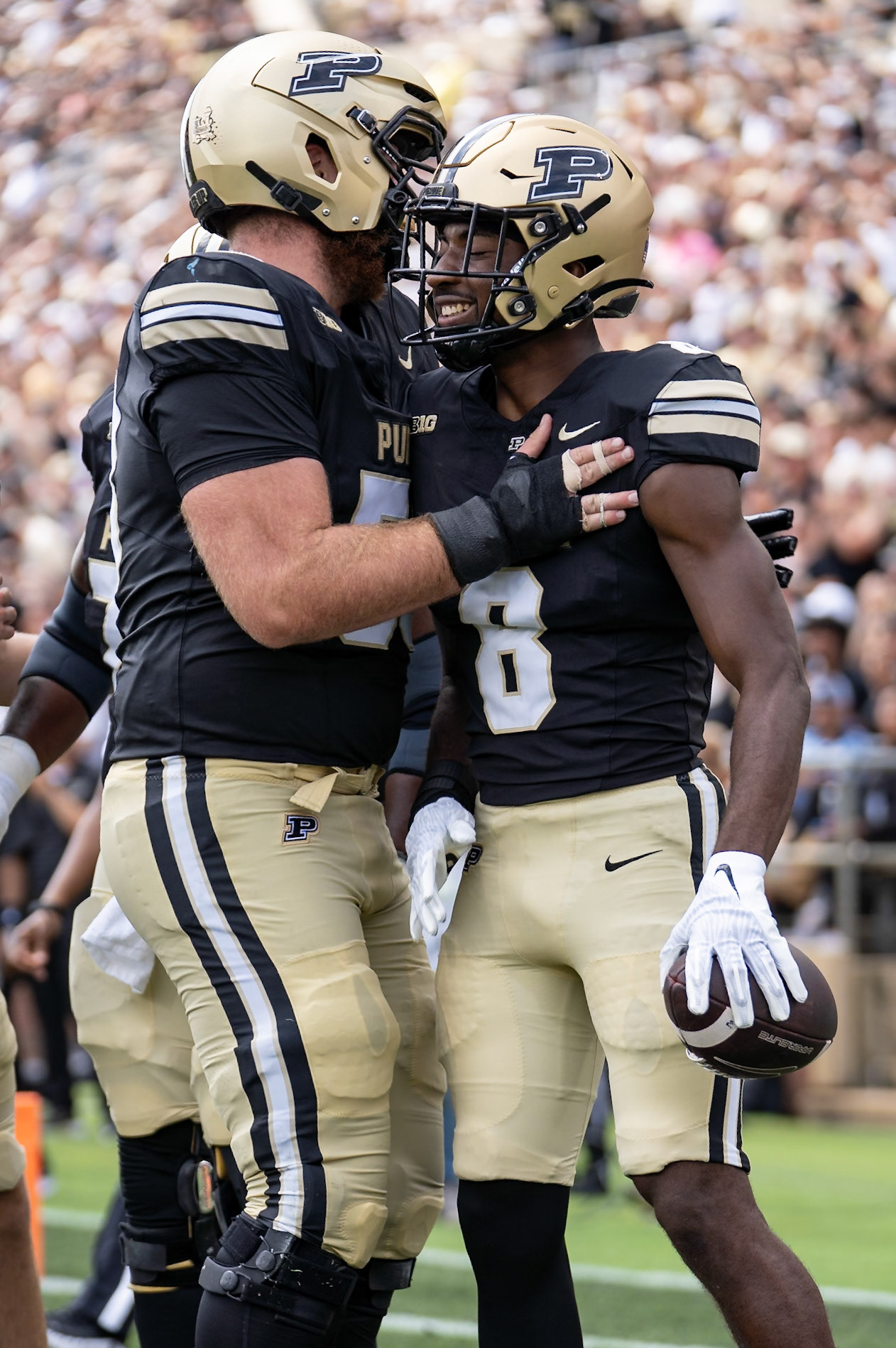 WEST LAFAYETTE, IN - AUGUST 31, 2024: Purdue So. WR De'Nylon Morrissette (8) and Purdue Sr. OL Gus Hartwig (53) celebrate a touchdown in the Purdue Boilermaker Football vs Indiana State Sycamores at Ross-Ade Stadium(Photo by Steve Bowen / Bowen Arrow Photography / Northern Indiana Sports Report)