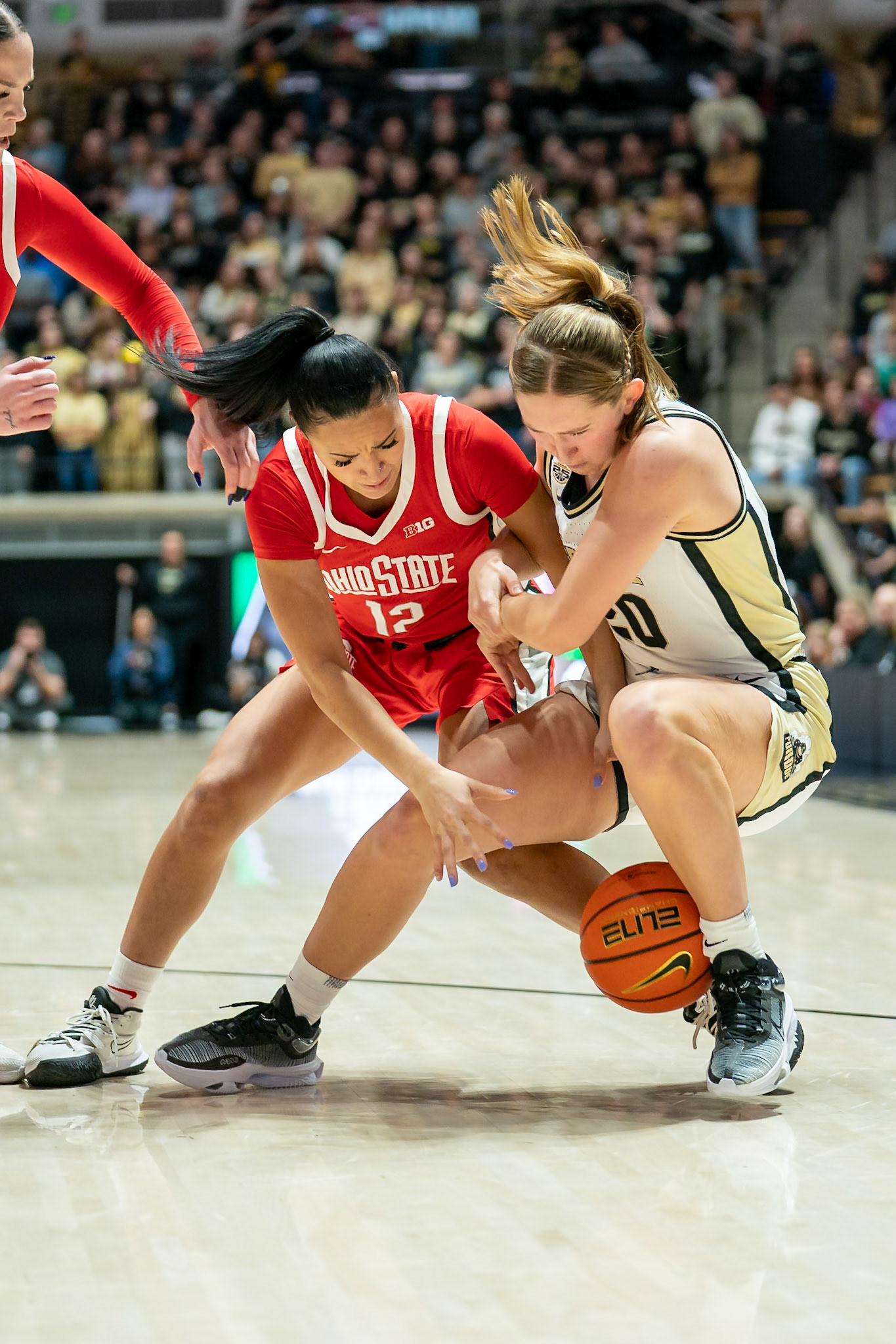 WEST LAFAYETTE, IN - JANUARY 28, 2024: Ohio State Guard Graduate Celeste Taylor (12), Purdue Freshman Forward Mary Ashley Stevenson (20) competing in Purdue Boilermaker Women's Basketball versus the Ohio State Buckeyes at Mackey Arena(Photo by Steve Bowen / Bowen Arrow Photography / Northern Indiana Sports Report)