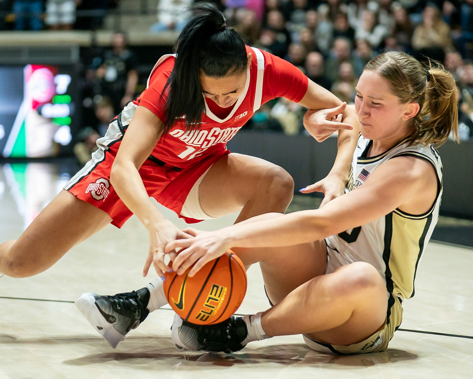 WEST LAFAYETTE, IN - JANUARY 28, 2024: Ohio State Guard Graduate Celeste Taylor (12), Purdue Freshman Forward Mary Ashley Stevenson (20) competing in Purdue Boilermaker Women's Basketball versus the Ohio State Buckeyes at Mackey Arena(Photo by Steve Bowen / Bowen Arrow Photography / Northern Indiana Sports Report)