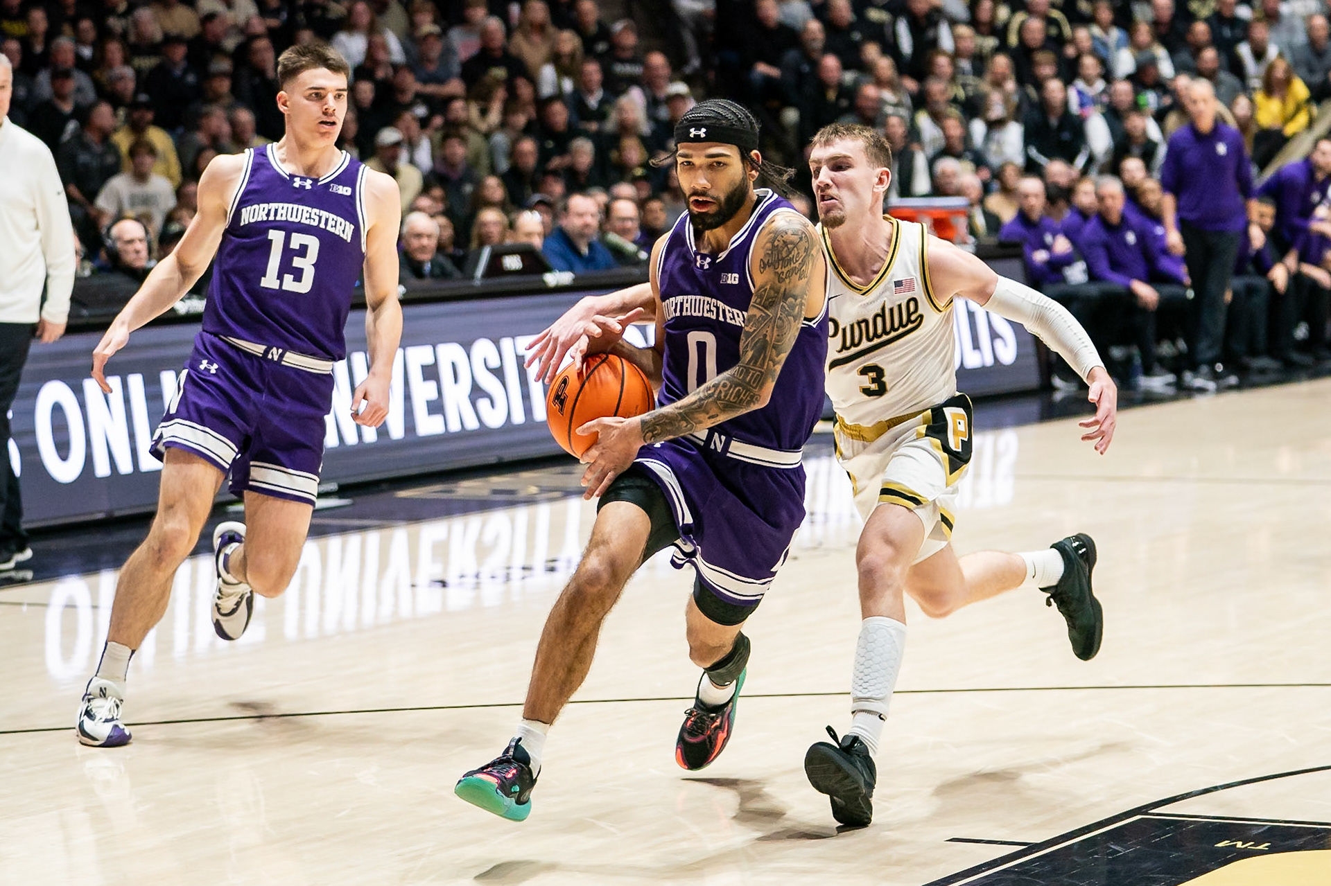 WEST LAFAYETTE, IN - JANUARY 31, 2024: Northwestern Graduate Guard Boo Buie (0), Purdue Sophomore Guard Braden Smith (3) competing in Purdue Boilermakers Mens Basketball versus the Northwestern Wildcats at Mackey Arena(Photo by Steve Bowen / Bowen Arrow Photography / Northern Indiana Sports Report)