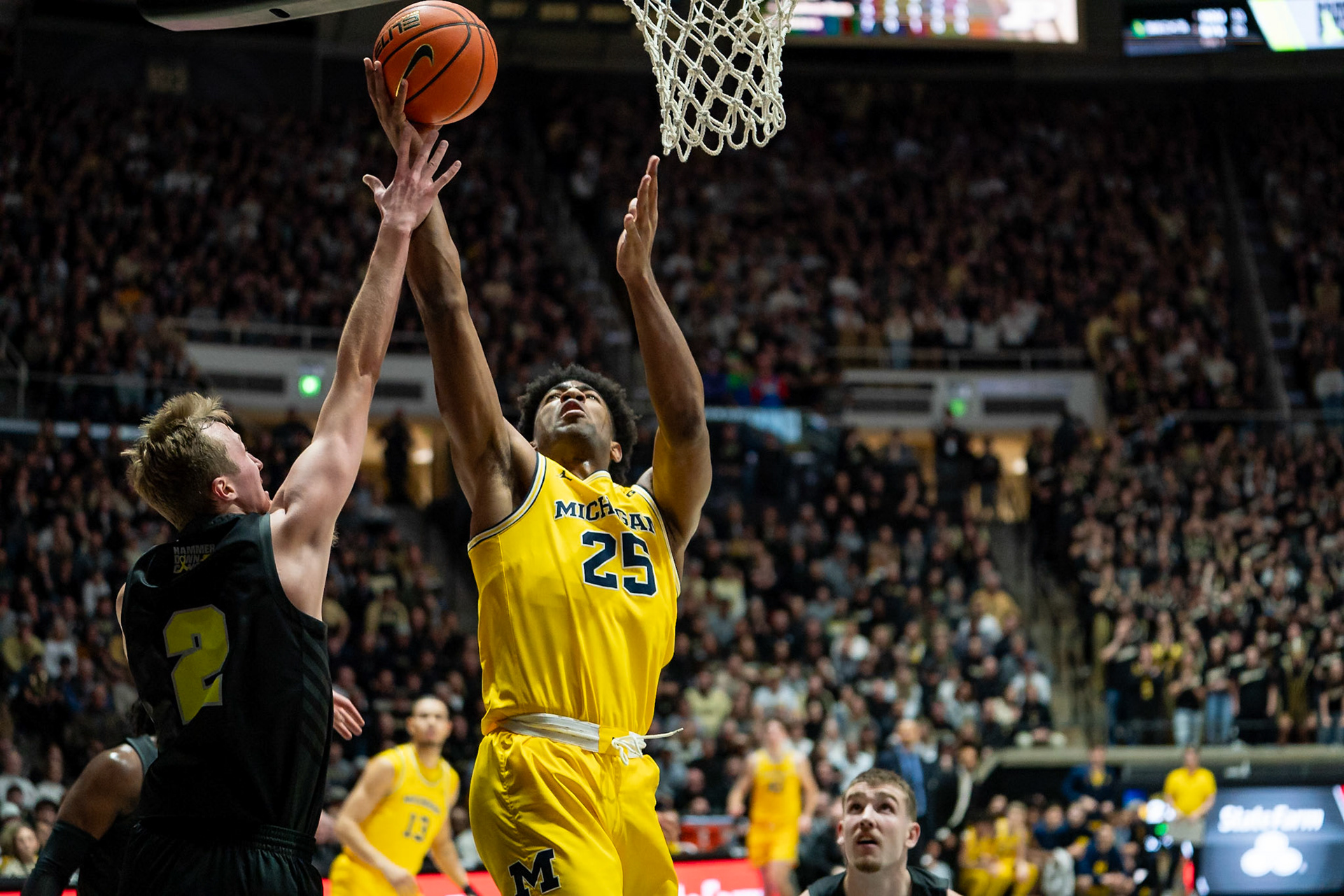 WEST LAFAYETTE, IN - JANUARY 23, 2024: Michigan Junior Guard Jace Howard (25), Purdue Sophomore Guard Fletcher Loyer (2) competing in Purdue versus Michigan Mens Basketball at Mackey Arena(Photo by Steve Bowen / Bowen Arrow Photography / Northern Indiana Sports Report)