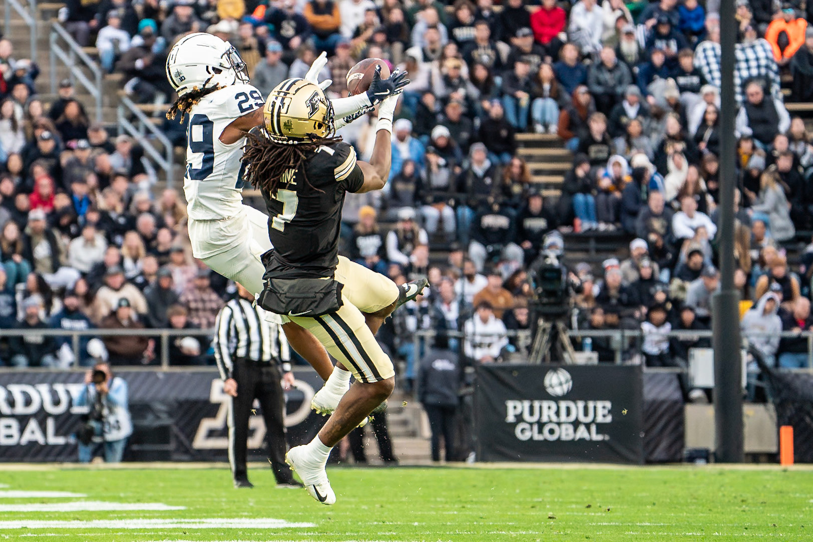 WEST LAFAYETTE, IN - NOVEMBER 16, 2024: Purdue University Junior Wide Receiver Jahmal Edrine (7) snd Penn State University's Cornerback Audavion Collins (29) both jump to catch a pass in the Purdue University Boilermakers vs Penn State University Nittany Lions Football game at Ross-Ade Stadium(Photo by Steve Bowen / Bowen Arrow Photography / Northern Indiana Sports Report)