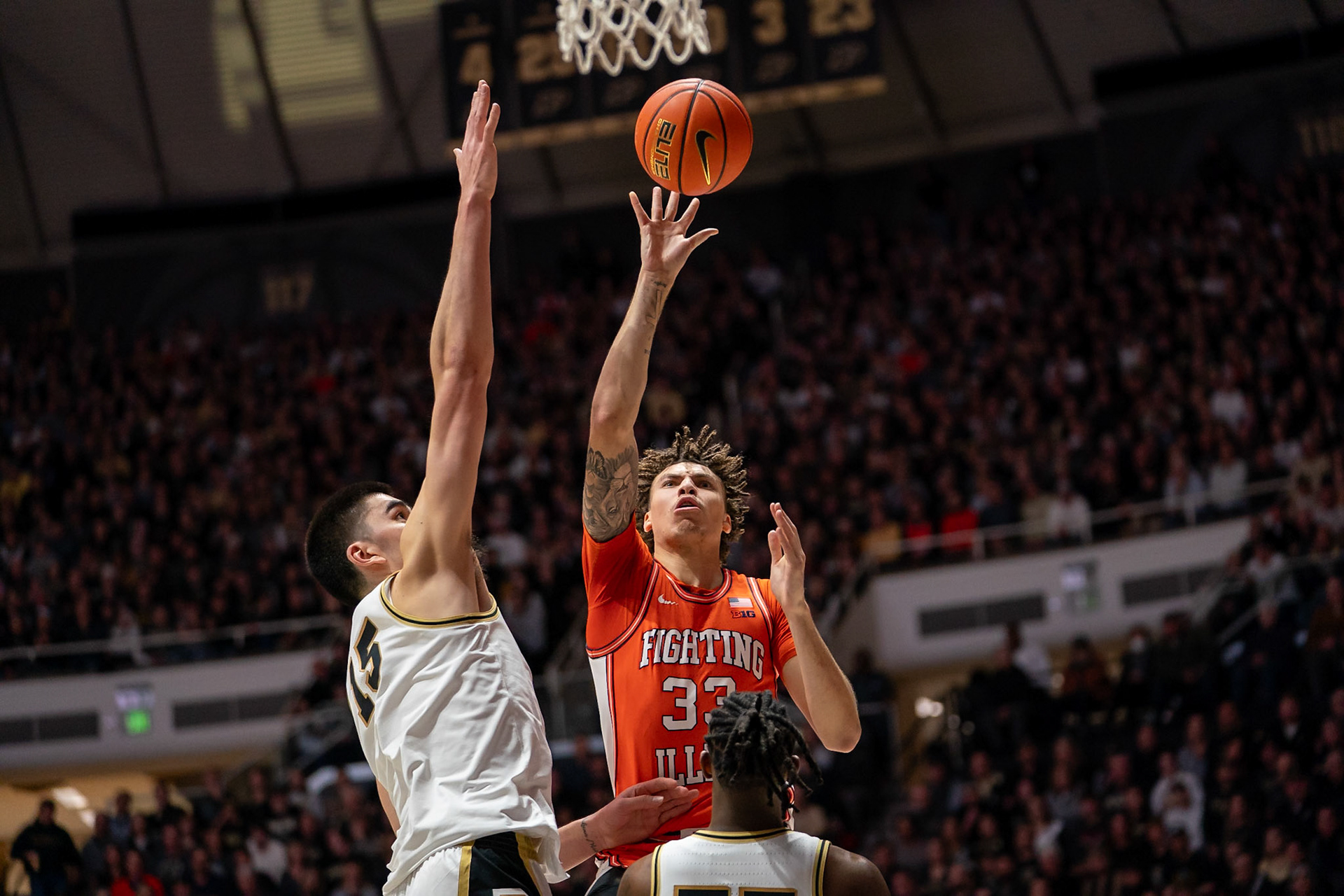 WEST LAFAYETTE, IN - JANUARY 5, 2024: Illinois Senior Forward Coleman Hawkins (33) shoots the ball while Purdue Senior Center Zach Edey (15) goes after a block in Purdue Boilermaker's Basketball vs the Illinois Fighting Illini at Mackey Arena(Photo by Steve Bowen / Bowen Arrow Photography / Northern Indiana Sports Report)