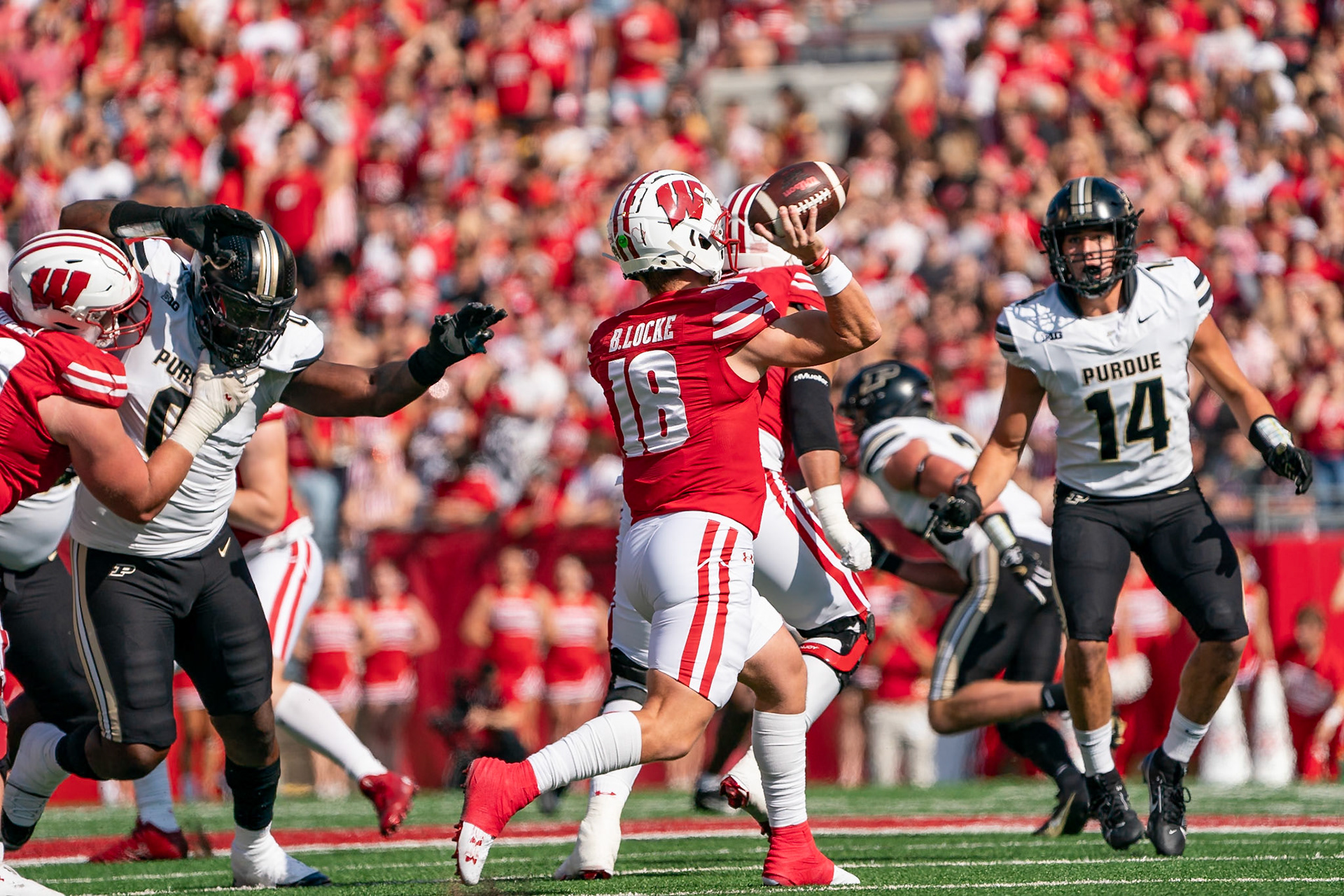 MADISON, WI - OCTOBER 5, 2024: University of Wisconsin Redshirt Sophomore QB Braedyn Locke (18) throwing a pass during the Purdue University Boilermakers at University of Wisconsin Badger Football game at Camp Randall Stadium(Photo by Steve Bowen / NISports Report)