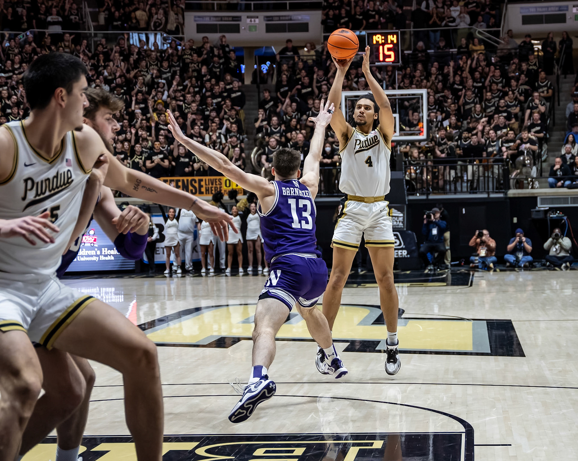 WEST LAFAYETTE, IN - JANUARY 31, 2024: Purdue Sophomore Forward Trey Kaufman-Renn (4), Northwestern Junior Guard Brooks Barnhizer (13) competing in Purdue Boilermakers Mens Basketball versus the Northwestern Wildcats at Mackey Arena(Photo by Steve Bowen / Bowen Arrow Photography / Northern Indiana Sports Report)