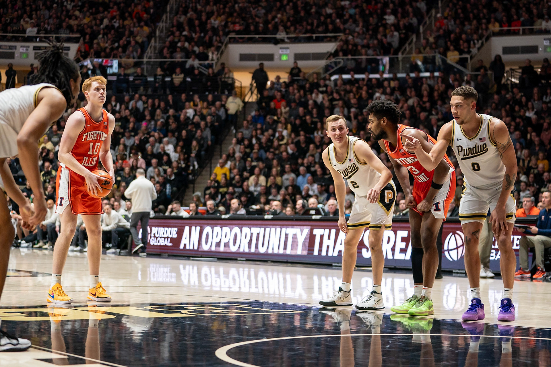 WEST LAFAYETTE, IN - JANUARY 5, 2024: Illinois Junior Guard/Forward Luke Goode (10) shoots a free throw while Purdue Sophomore Guard Fletcher Loyer (2), Purdue Senior Forward Mason Gillis (0) and Illinois Graduate Guard/Forward Quincy Guerrier (13) prepare to rebound in Purdue Boilermaker's Basketball vs the Illinois Fighting Illini at Mackey Arena(Photo by Steve Bowen / Bowen Arrow Photography / Northern Indiana Sports Report)