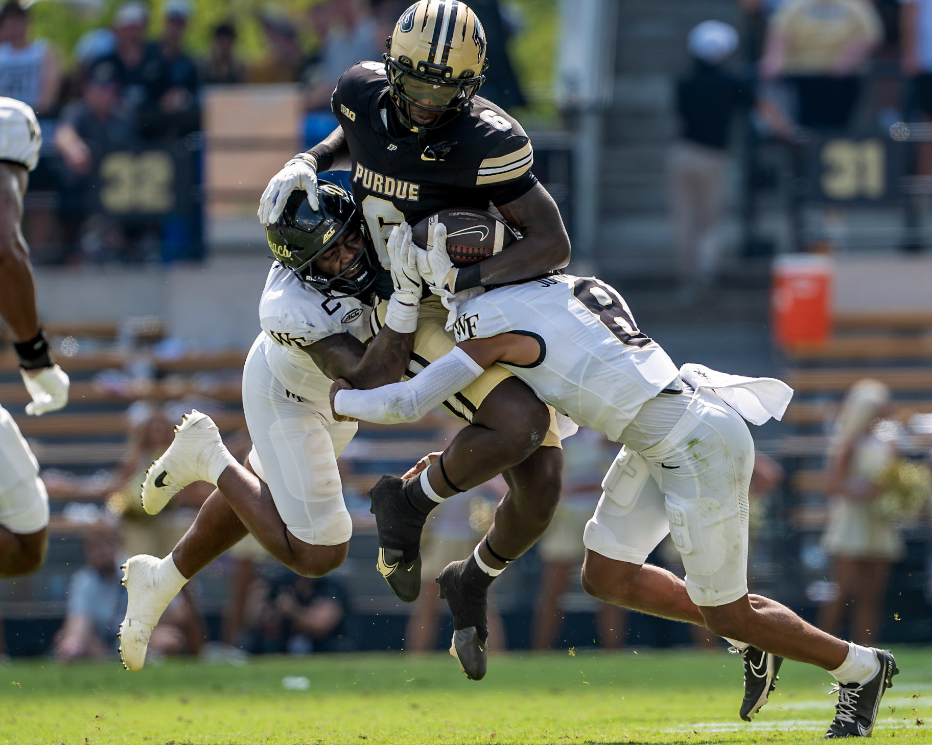 WEST LAFAYETTE, IN - SEPTEMBER 12, 2026: Purdue University Freshman Tight End Ar'Mari Towns (6) gets sandwiched between Wake Forest University Linebacker Aiden Hall (21) and Wake Forest University Defensive Back Braylon Johnson (8) during the Purdue Boilermakers football game vs the Wake Forest Demon Deacons at Ross-Ade Stadium(Photo by Steve Bowen / Northern Indiana Sports Report)