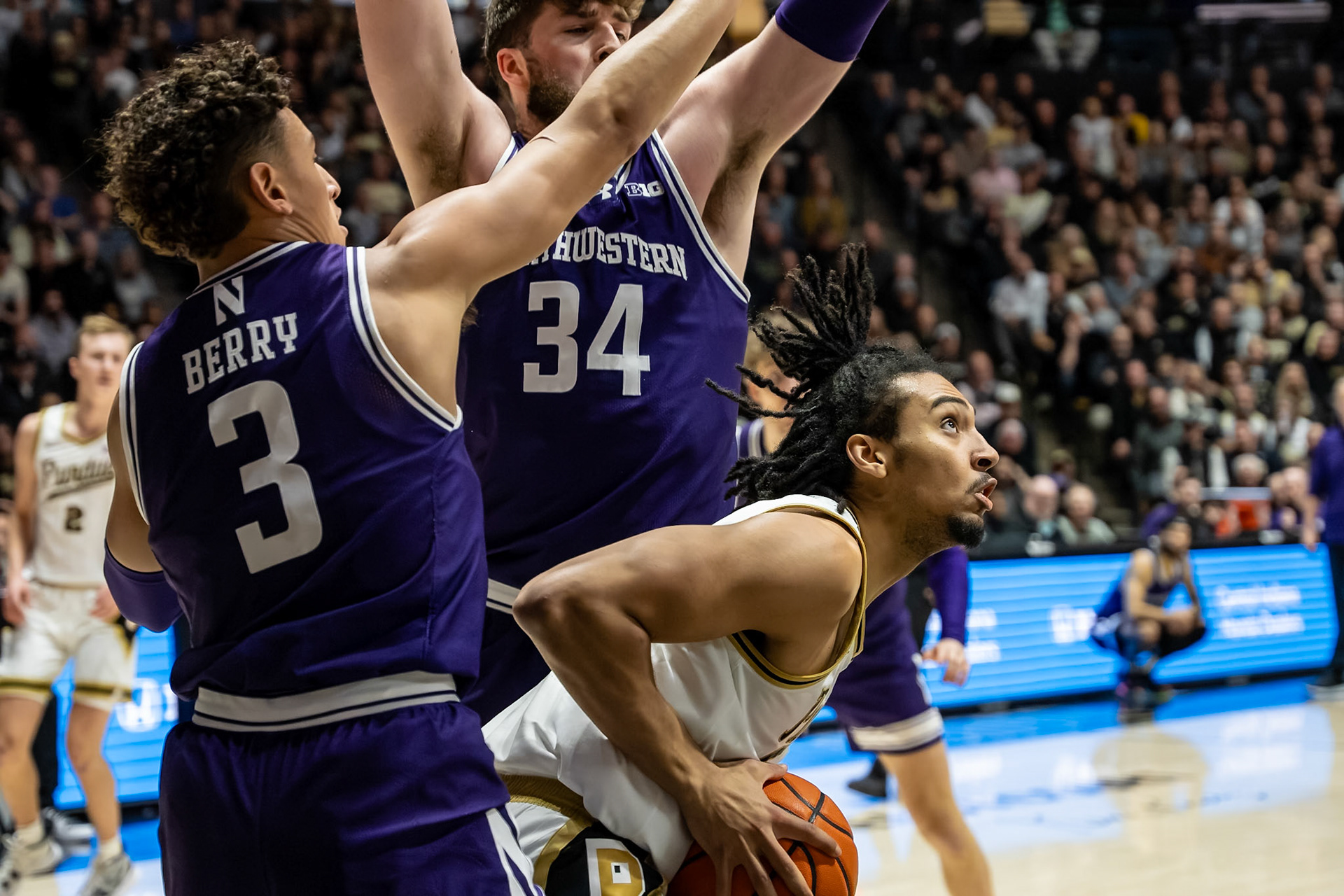 WEST LAFAYETTE, IN - JANUARY 31, 2024: Purdue Sophomore Forward Trey Kaufman-Renn (4), Northwestern Senior Center Matthew Nicholson (34), Northwestern Senior Guard Ty Berry (3) competing in Purdue Boilermakers Mens Basketball versus the Northwestern Wildcats at Mackey Arena(Photo by Steve Bowen / Bowen Arrow Photography / Northern Indiana Sports Report)