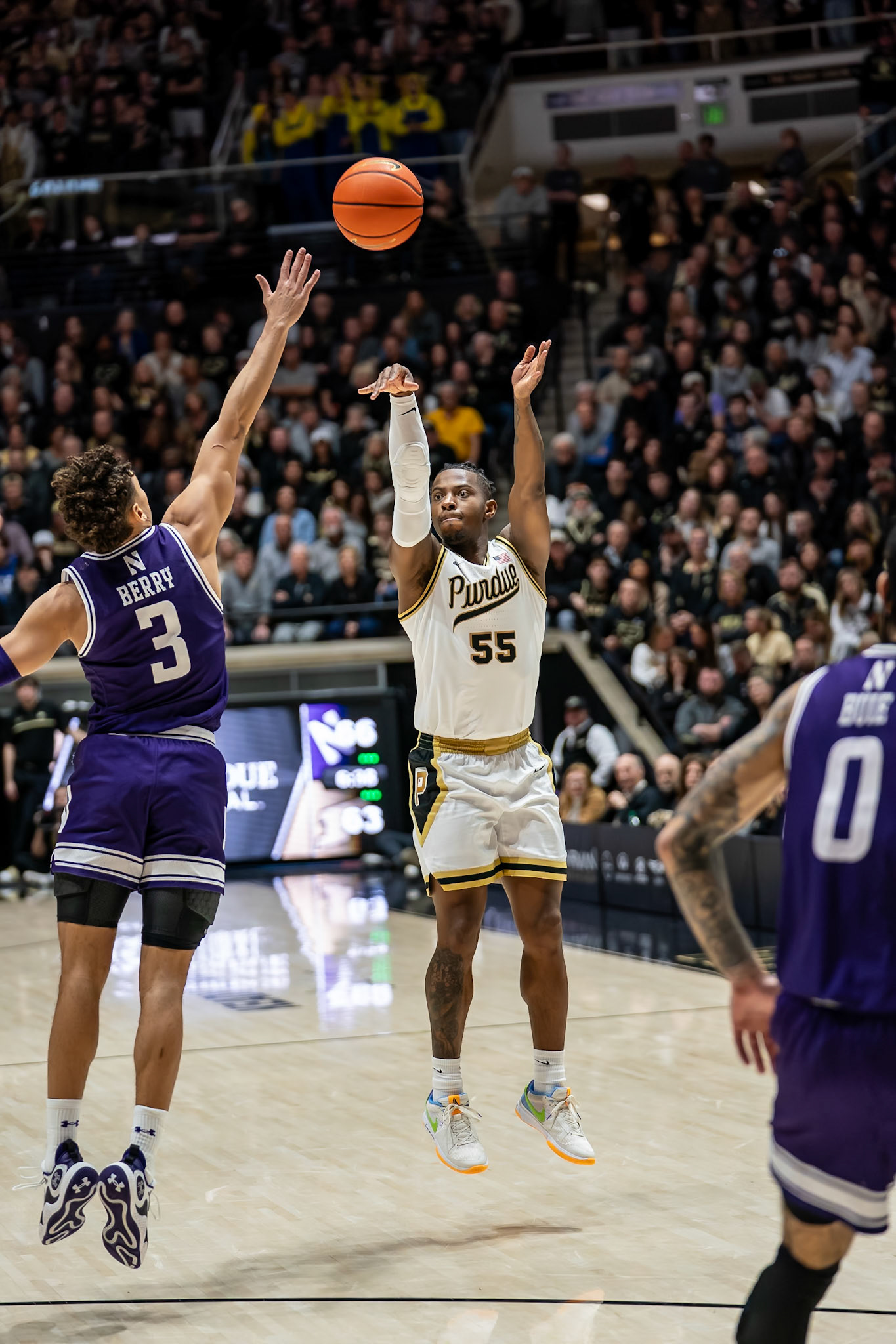 WEST LAFAYETTE, IN - JANUARY 31, 2024: Purdue 5th year Guard Lance Jones (55), Northwestern Senior Guard Ty Berry (3) competing in Purdue Boilermakers Mens Basketball versus the Northwestern Wildcats at Mackey Arena(Photo by Steve Bowen / Bowen Arrow Photography / Northern Indiana Sports Report)