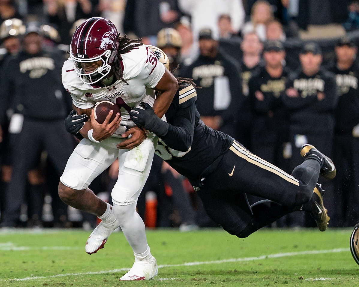WEST LAFAYETTE, IN - SEPTEMBER 6, 2025: Southern Illinois University Sr. QB DJ Williams (1) gets dragged down by Purdue University Sophomore Defensive End Breeon Ishmail (58) at Purdue Boilermaker Football vs Southern Illinois Saluki Football at Ross-Ade Stadium(Photo by Steve Bowen / Northern Indiana Sports Report)