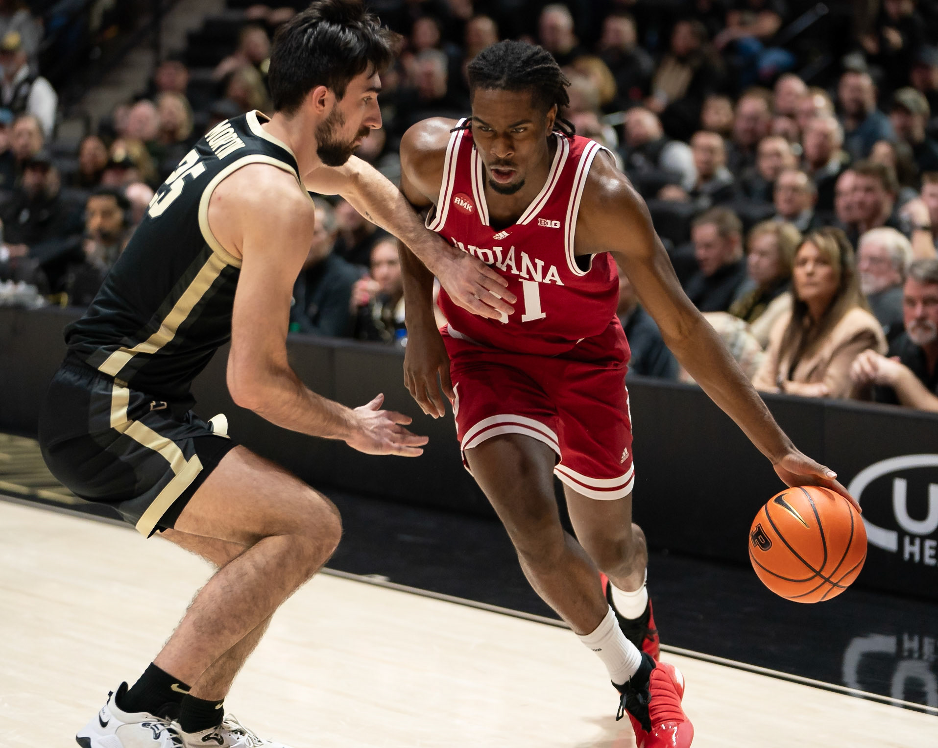 WEST LAFAYETTE, IN - FEBRUARY 10, 2024: Indiana Freshman Forward Mackenzie Mgbako (21), Purdue Senior Guard Ethan Morton (25) in Purdue Boilermaker vs Indiana Hoosiers Basketball at Mackey Arena(Photo by Steve Bowen / Bowen Arrow Photography / Northern Indiana Sports Report)