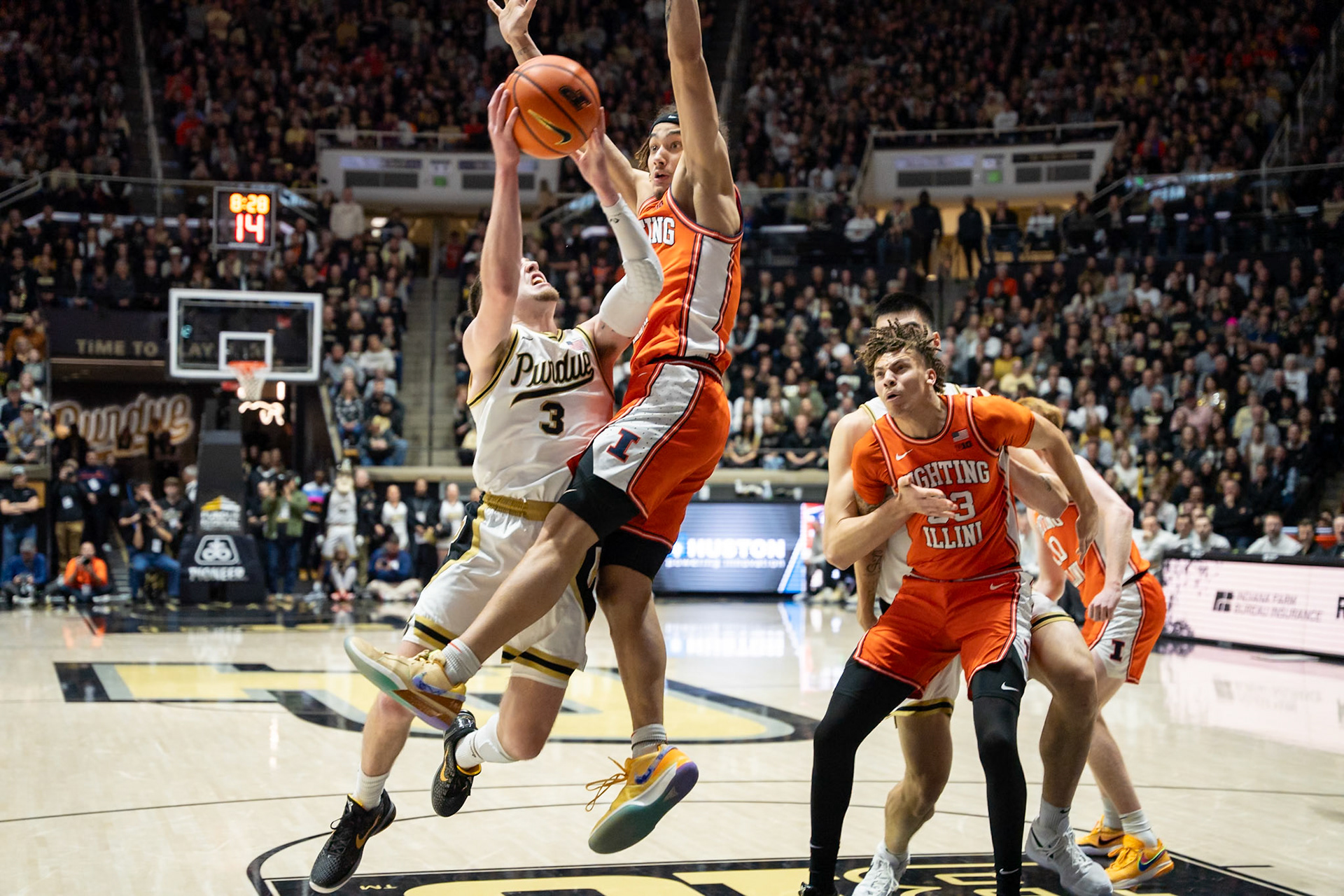 WEST LAFAYETTE, IN - JANUARY 5, 2024: Purdue Sophomore Guard Braden Smith (3) driving in for a shot while being defended by Illinois Freshman Guard Dra Gibbs-Lawhorn (2) competing in Purdue Boilermaker's Basketball vs the Illinois Fighting Illini at Mackey Arena(Photo by Steve Bowen / Bowen Arrow Photography / Northern Indiana Sports Report)
