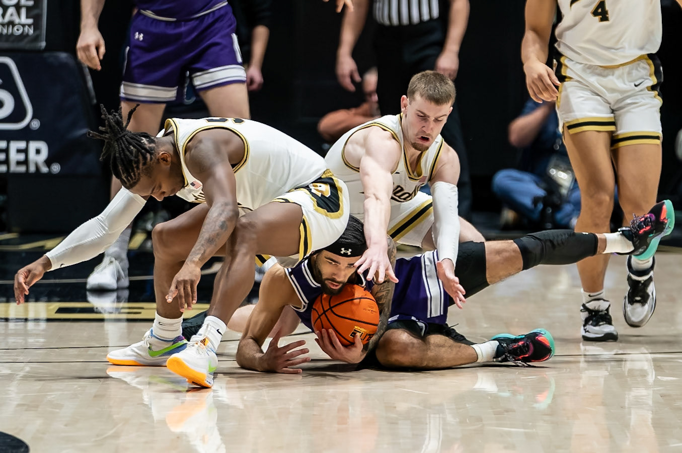 WEST LAFAYETTE, IN - JANUARY 31, 2024: Northwestern Graduate Guard Boo Buie (0), Purdue Sophomore Guard Braden Smith (3), Purdue 5th year Guard Lance Jones (55) competing in Purdue Boilermakers Mens Basketball versus the Northwestern Wildcats at Mackey Arena(Photo by Steve Bowen / Bowen Arrow Photography / Northern Indiana Sports Report)