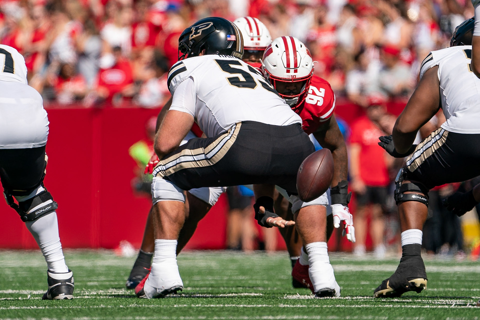 MADISON, WI - OCTOBER 5, 2024: Purdue University Senior Offensive Lineman Gus Hartwig (53) snapping the ball during the Purdue University Boilermakers at University of Wisconsin Badger Football game at Camp Randall Stadium(Photo by Steve Bowen / NISports Report)